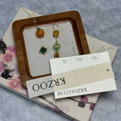 T glass ball asymmetrical long green earrings