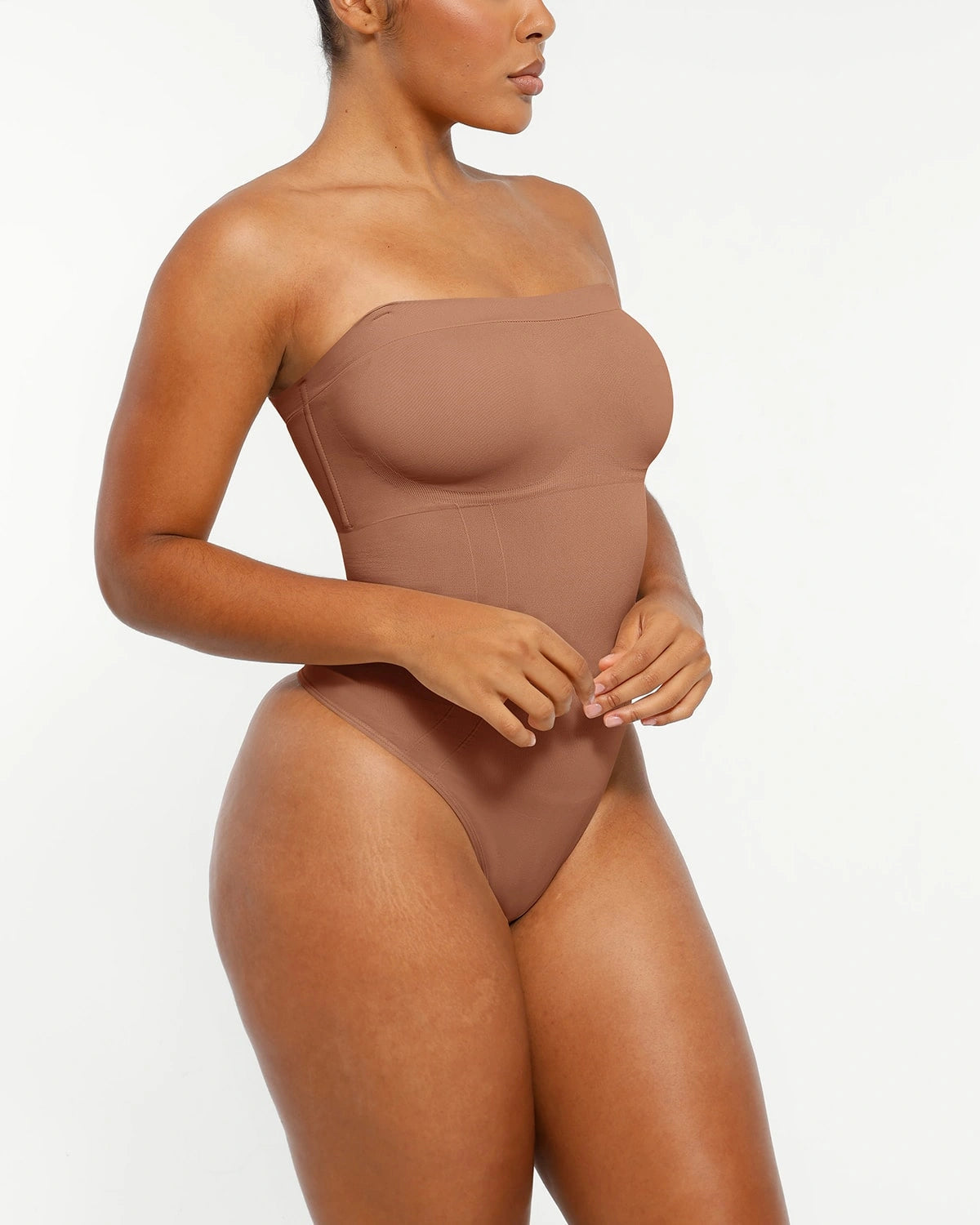 Bare Essentialsâ„?Skin Flow Strapless Sculpt Thong Bodysuit