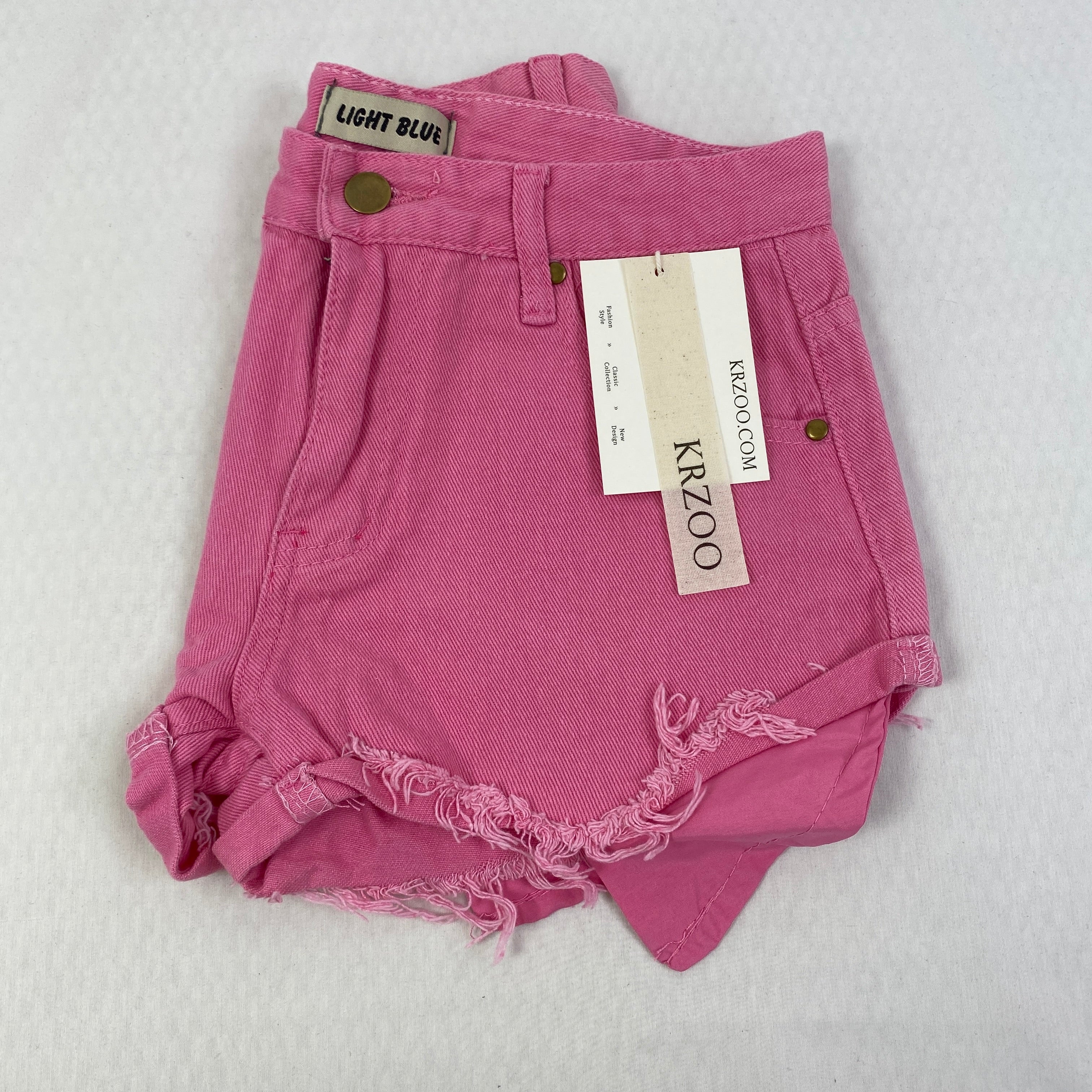 Jeans shorts with rolled hems and exposed pockets
