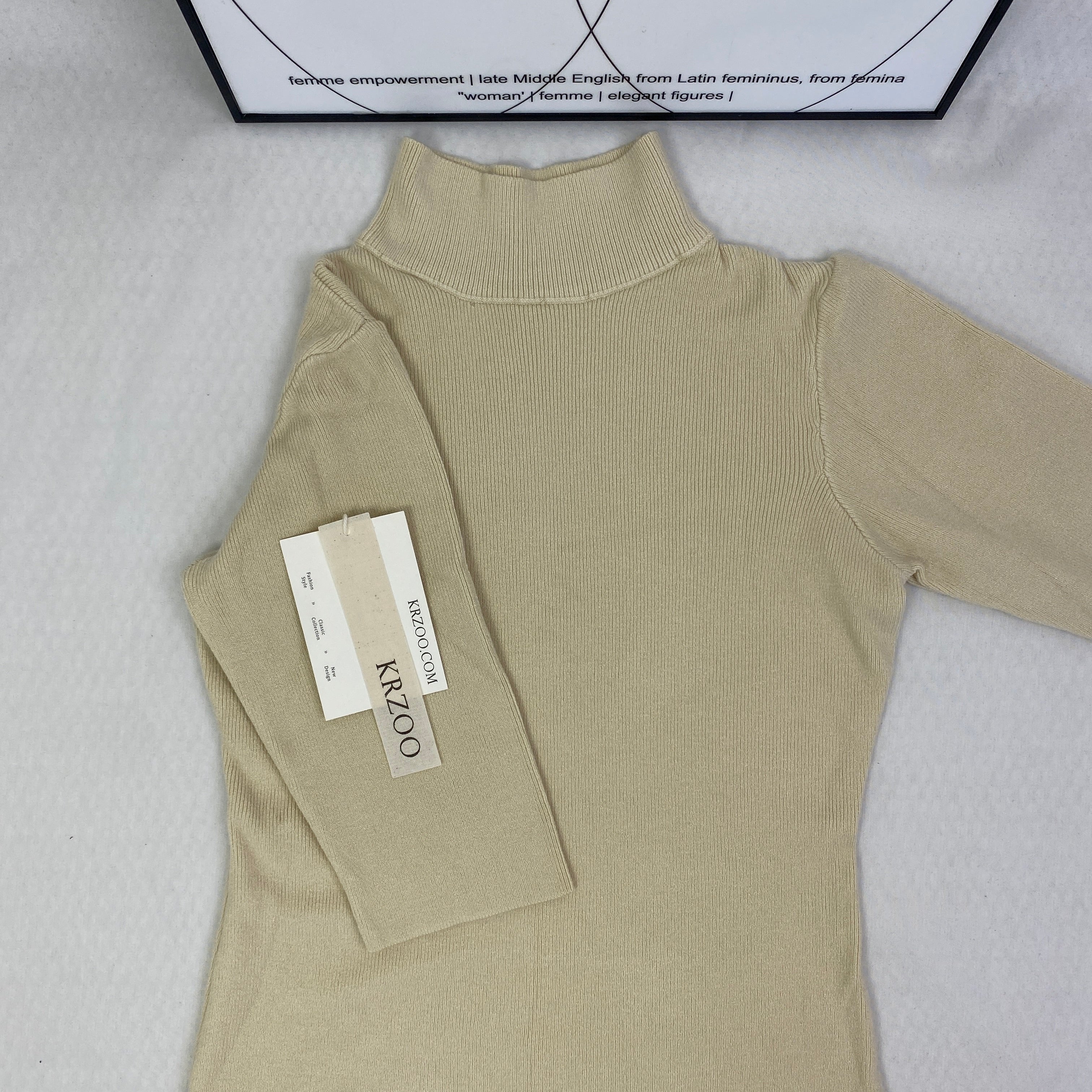 A fitted mid-neck knitted sweater
