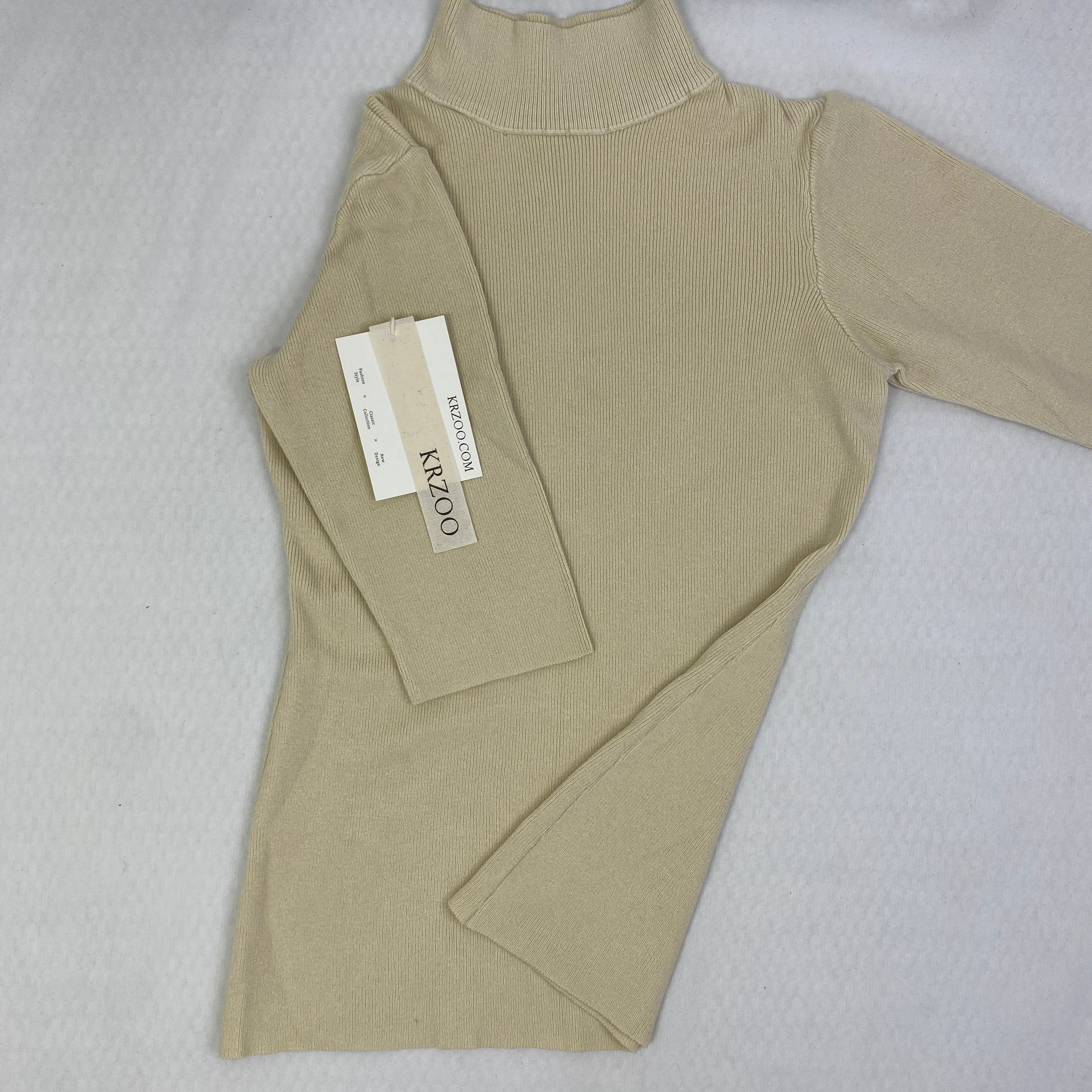 A fitted mid-neck knitted sweater