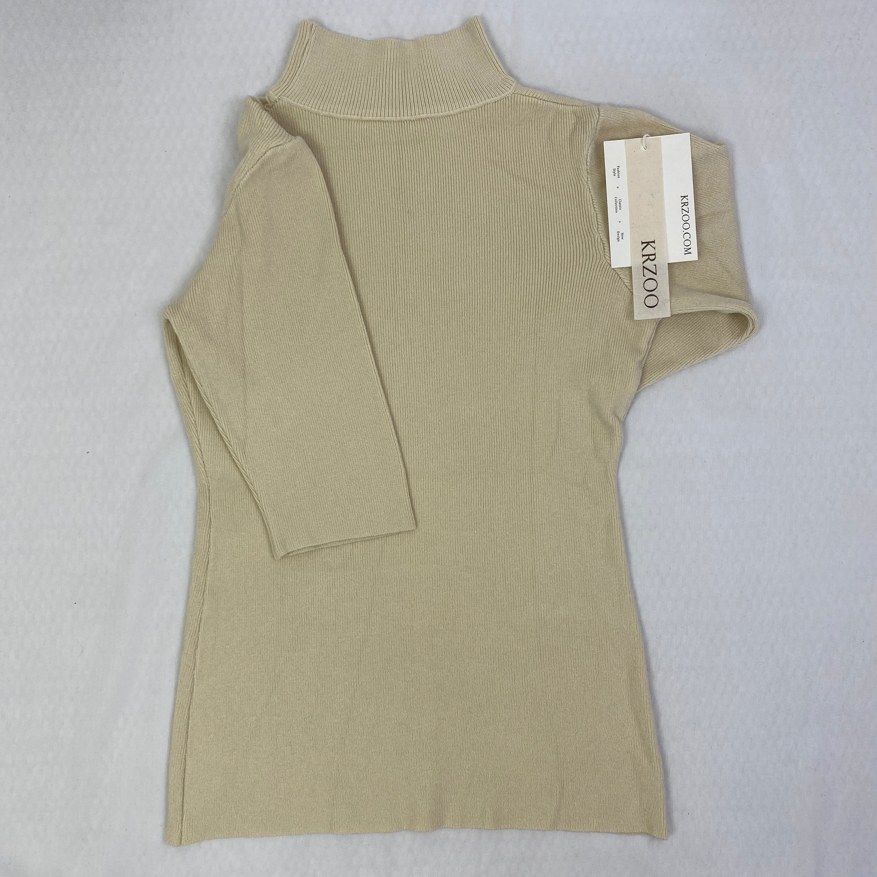 A fitted mid-neck knitted sweater
