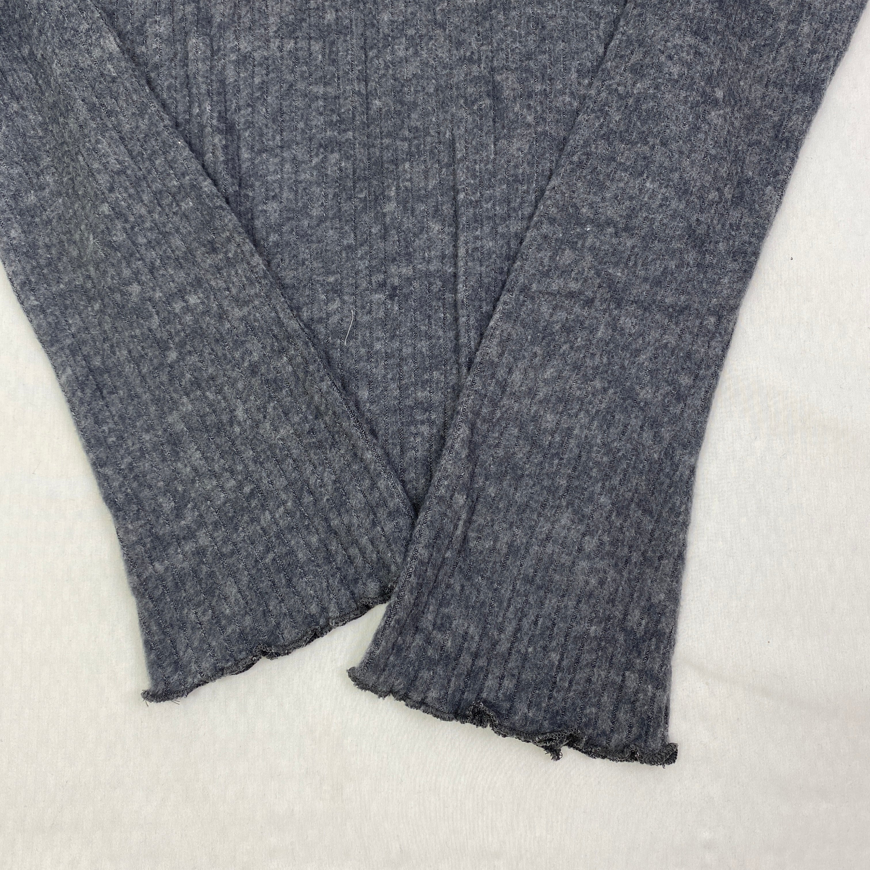 Irregularly cut, flared collar top