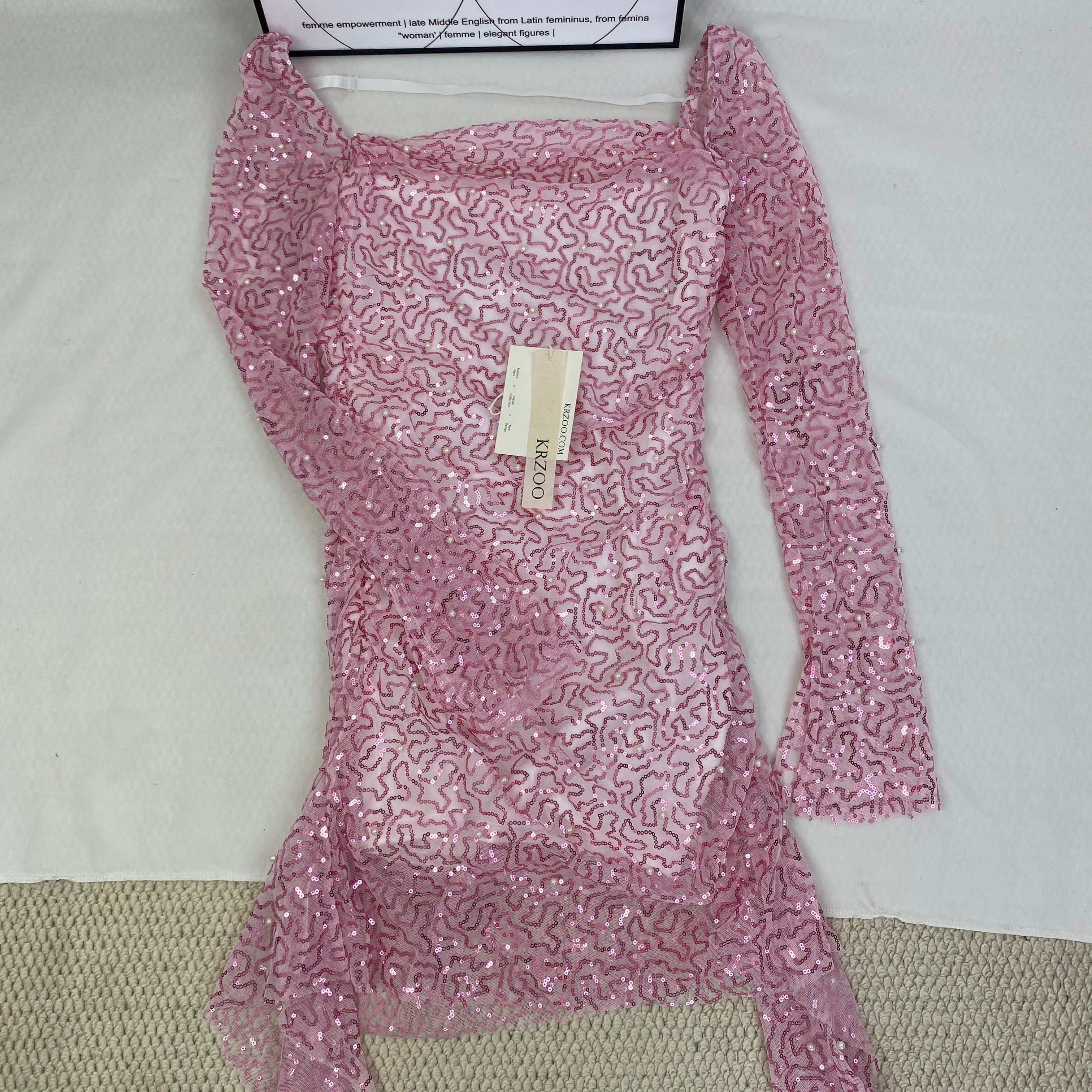 A slimming, soft pink, figure-hugging dress
