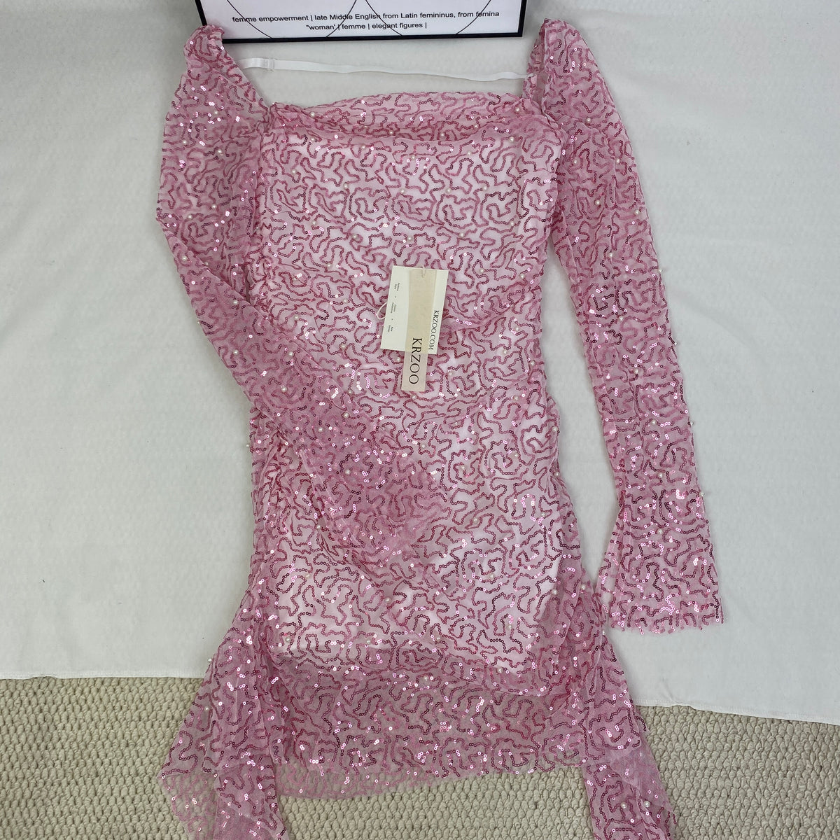 A slimming, soft pink, figure-hugging dress