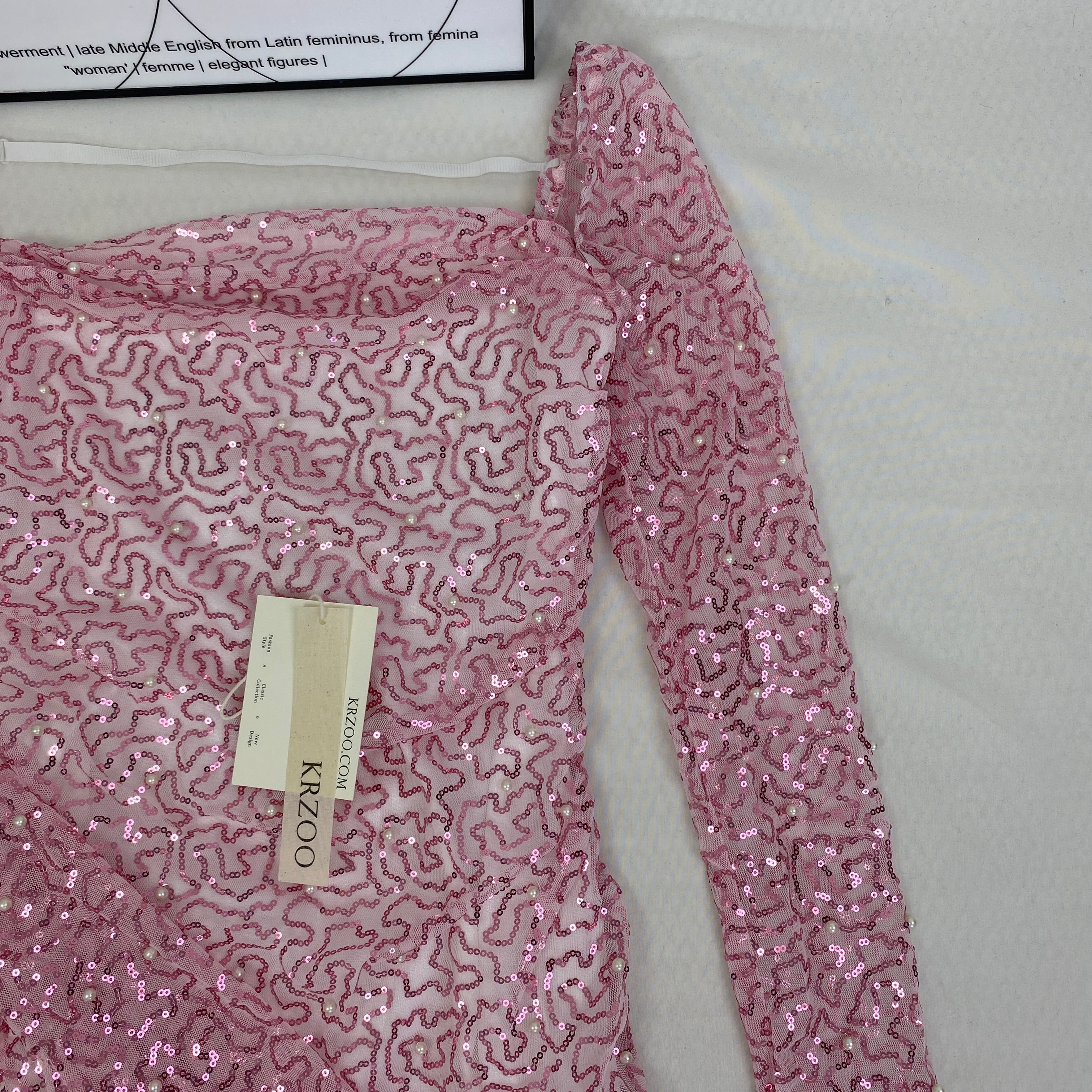 A slimming, soft pink, figure-hugging dress