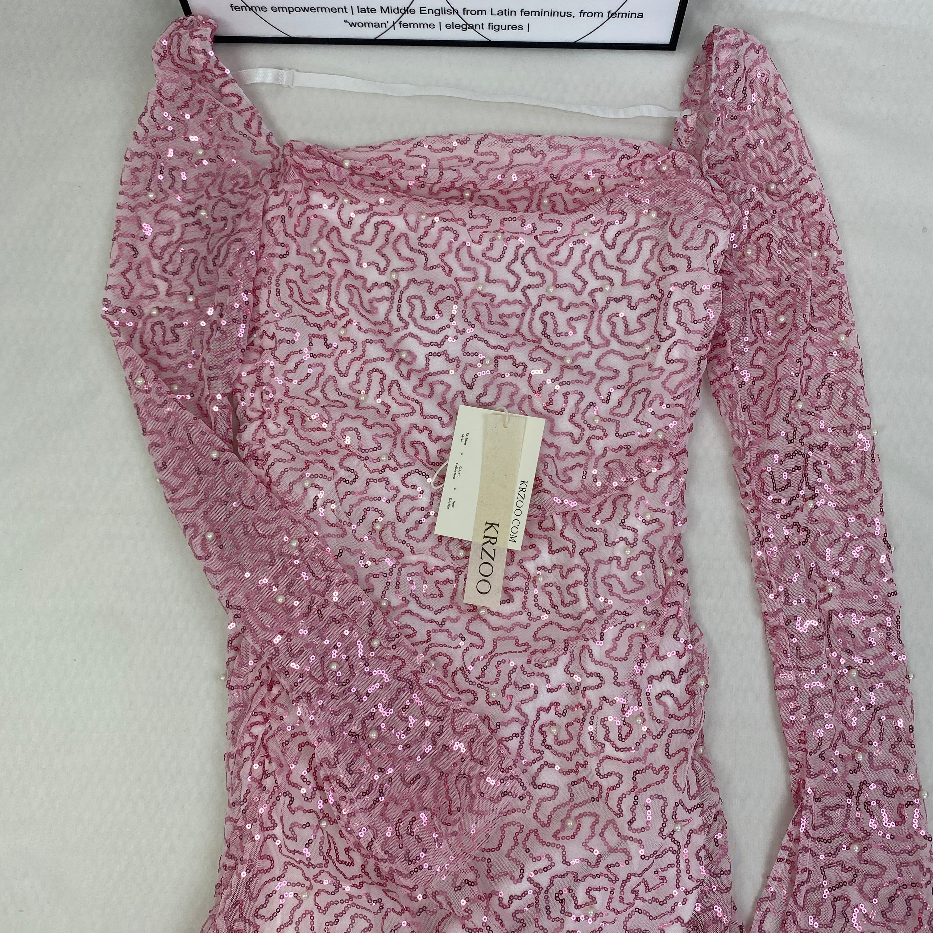 A slimming, soft pink, figure-hugging dress