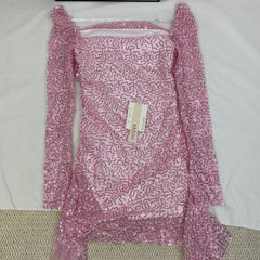 A slimming, soft pink, figure-hugging dress