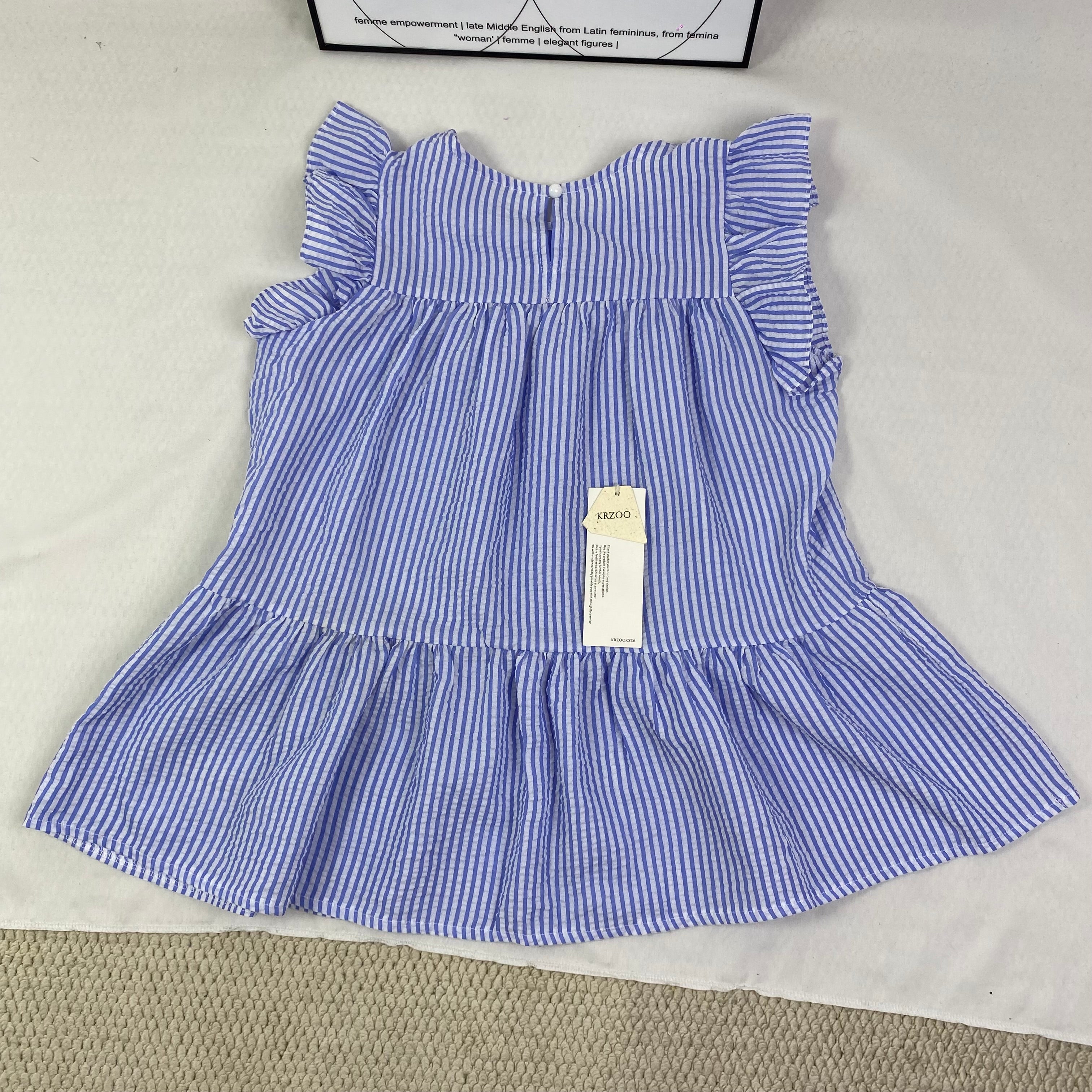Blue and white thin striped sleeveless shirt