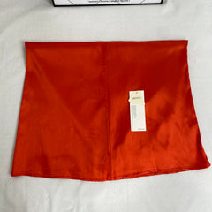 Half-length red A-line skirt