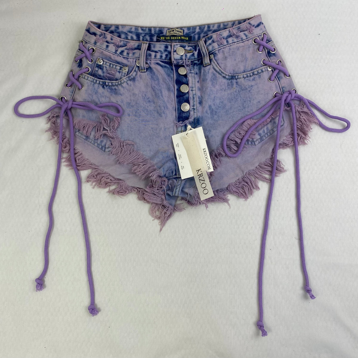 Purple strapped buttoned fringed shorts