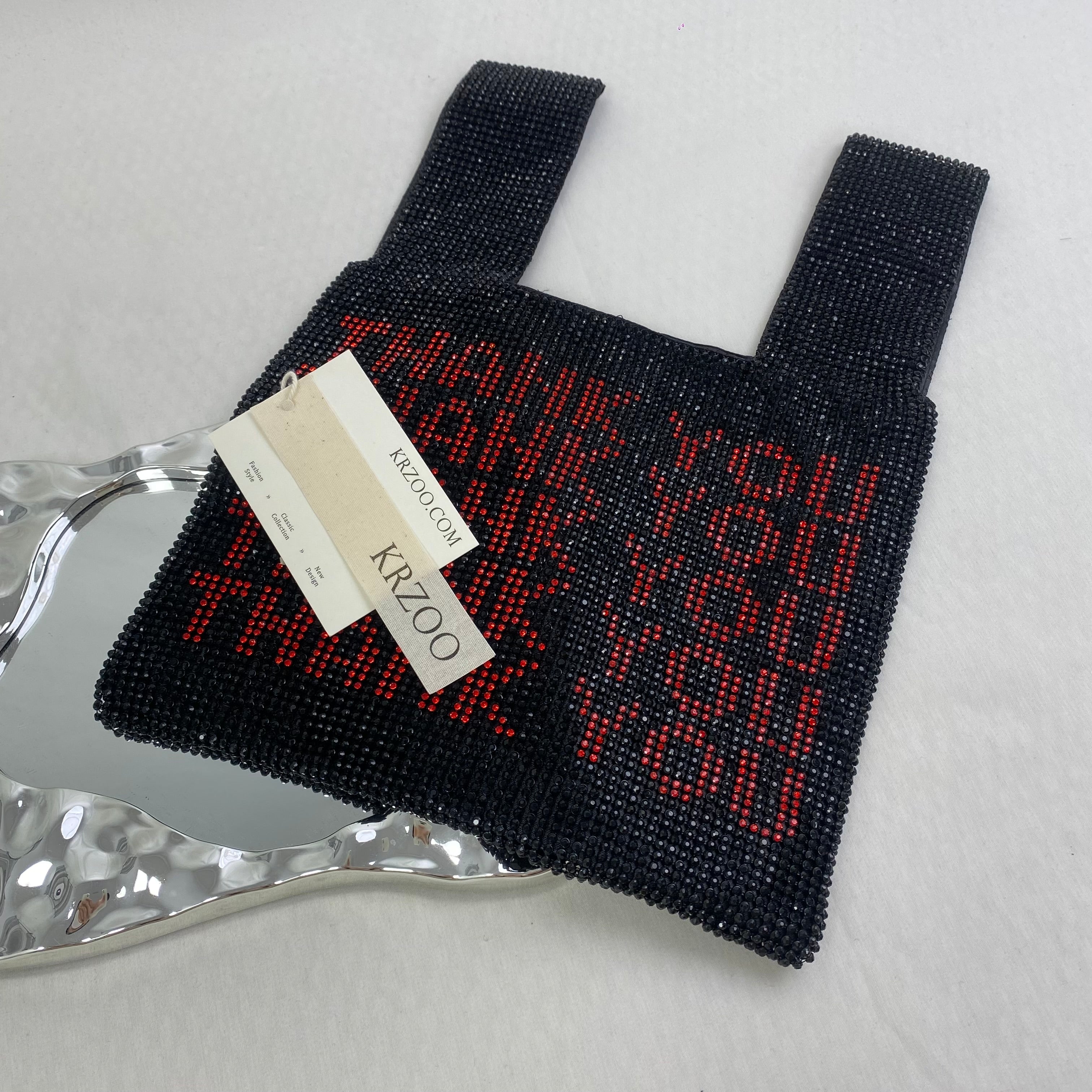 Diamond-studded heart-shaped handbag