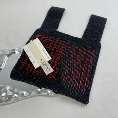 Diamond-studded heart-shaped handbag