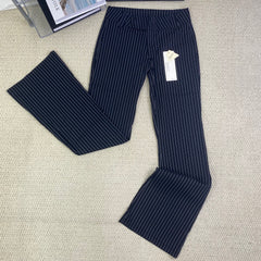 Striped pants are versatile and help slim the figure
