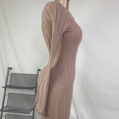 A fitted, ruffled edge knitted long dress