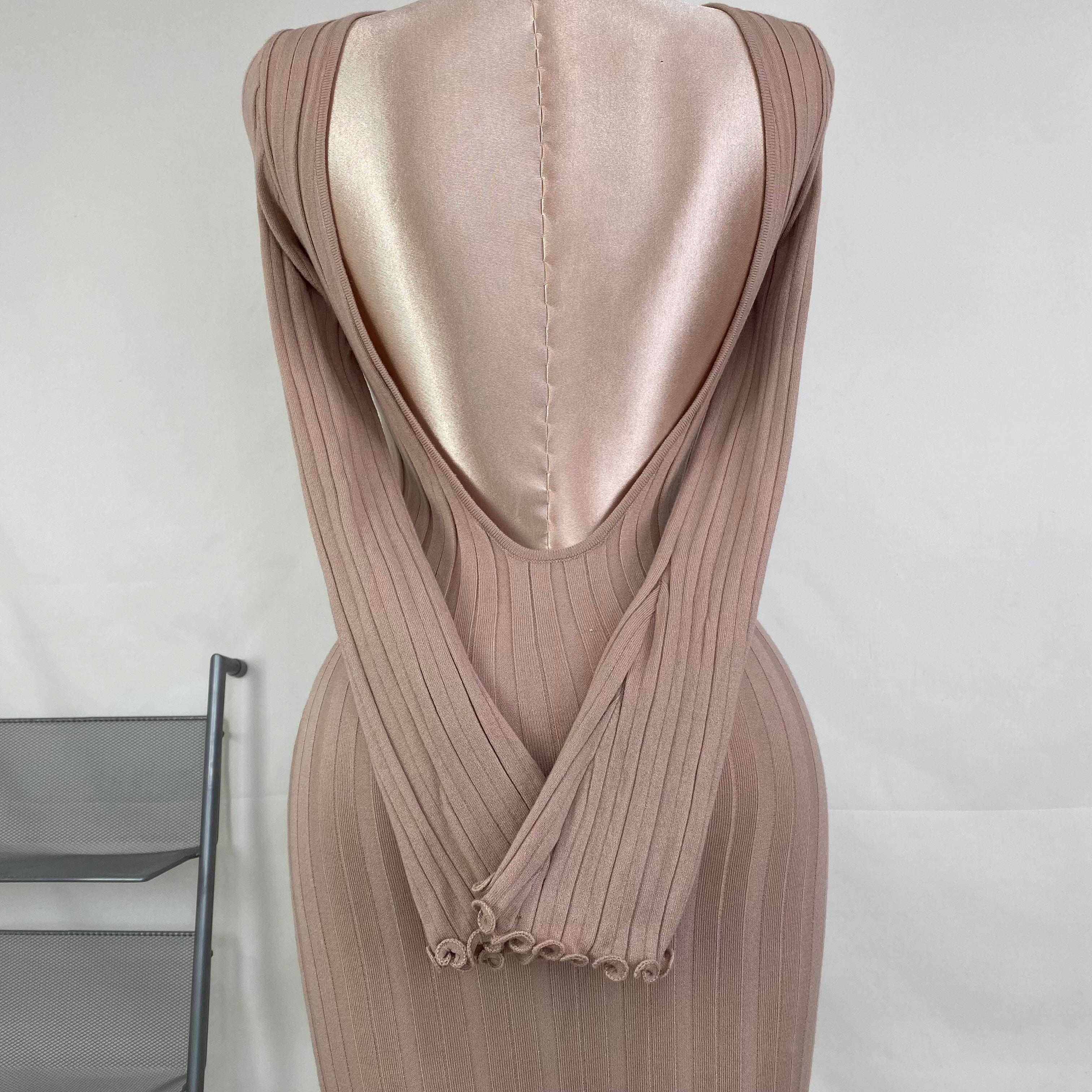 A fitted, ruffled edge knitted long dress