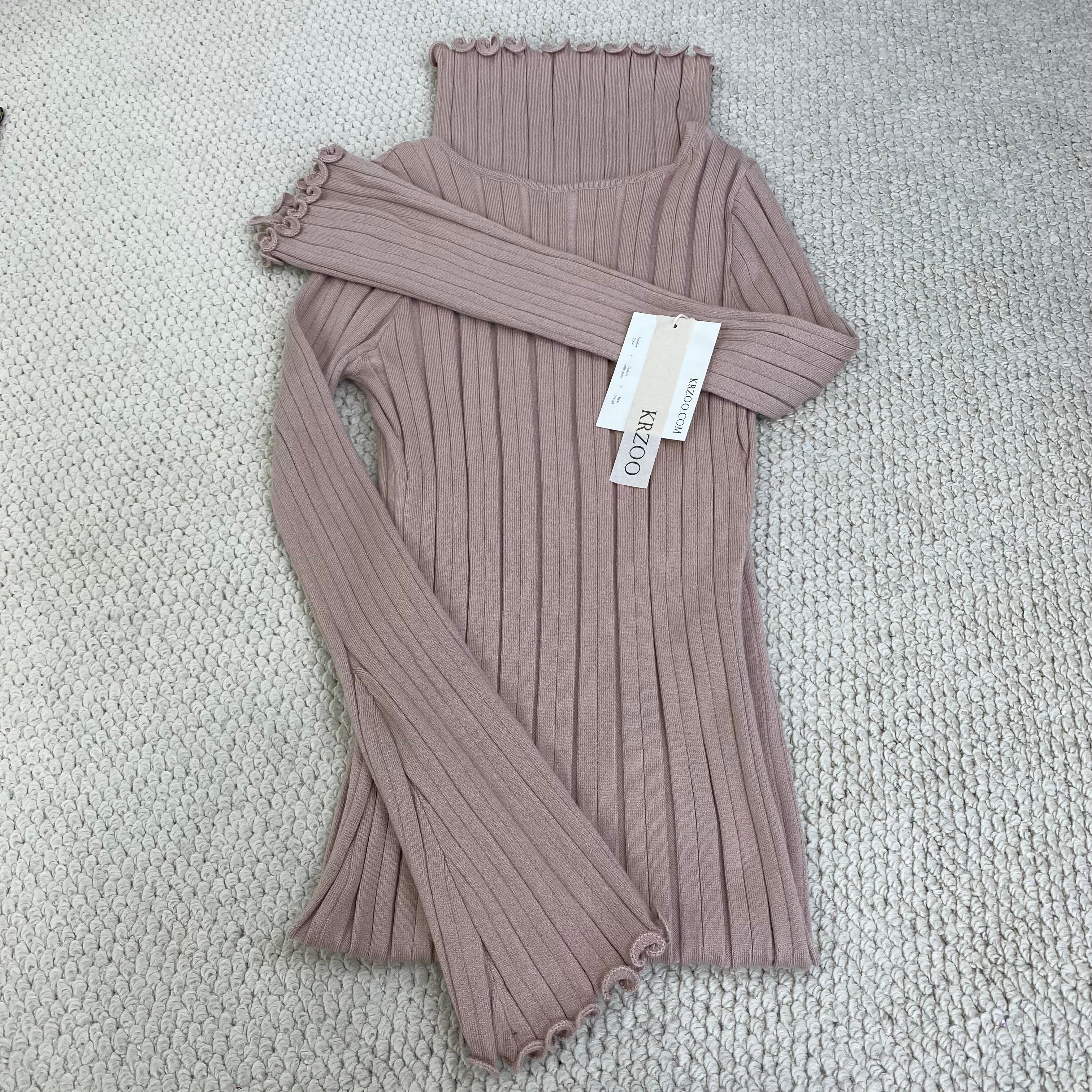 A fitted, ruffled edge knitted long dress