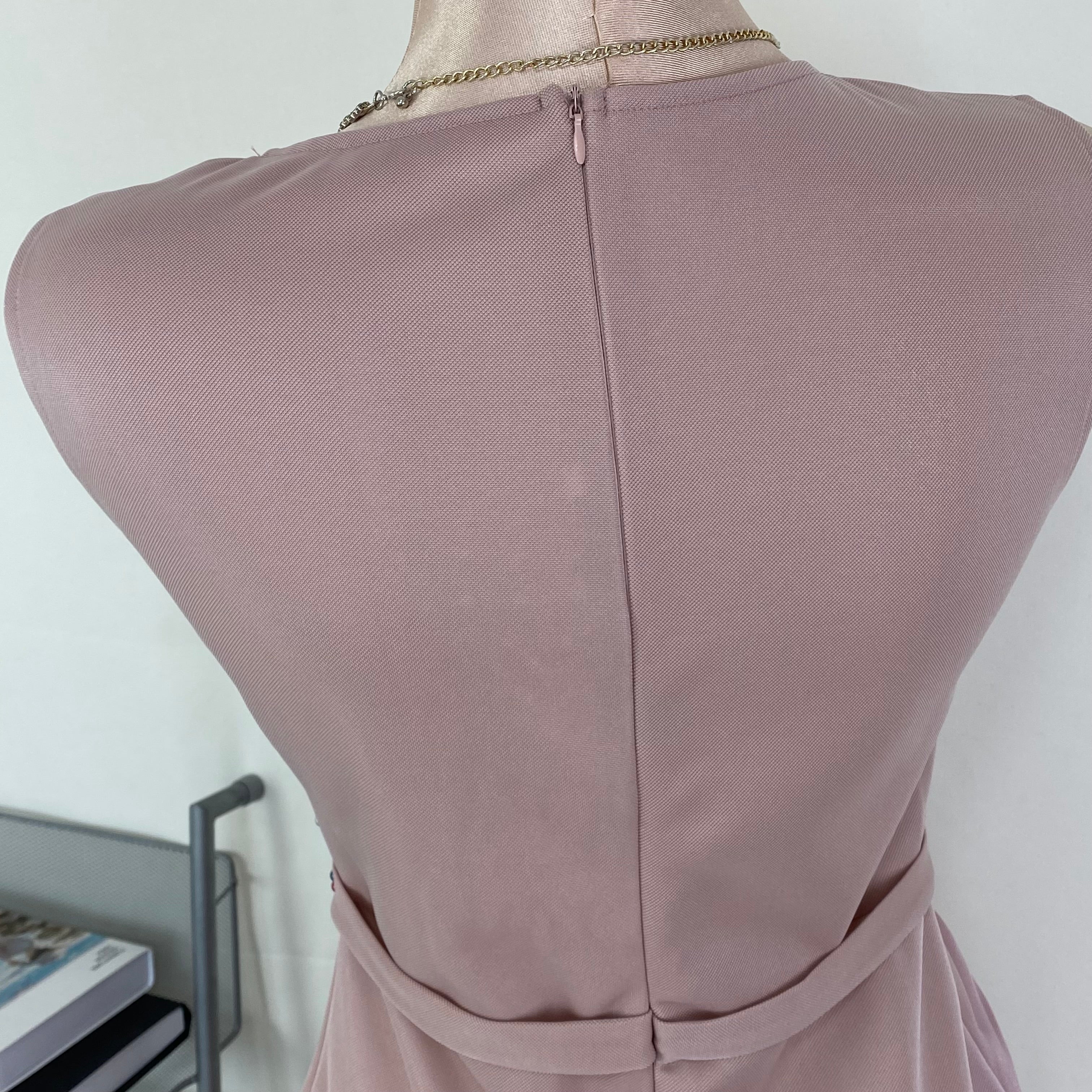 A halter-style and trailing evening dress