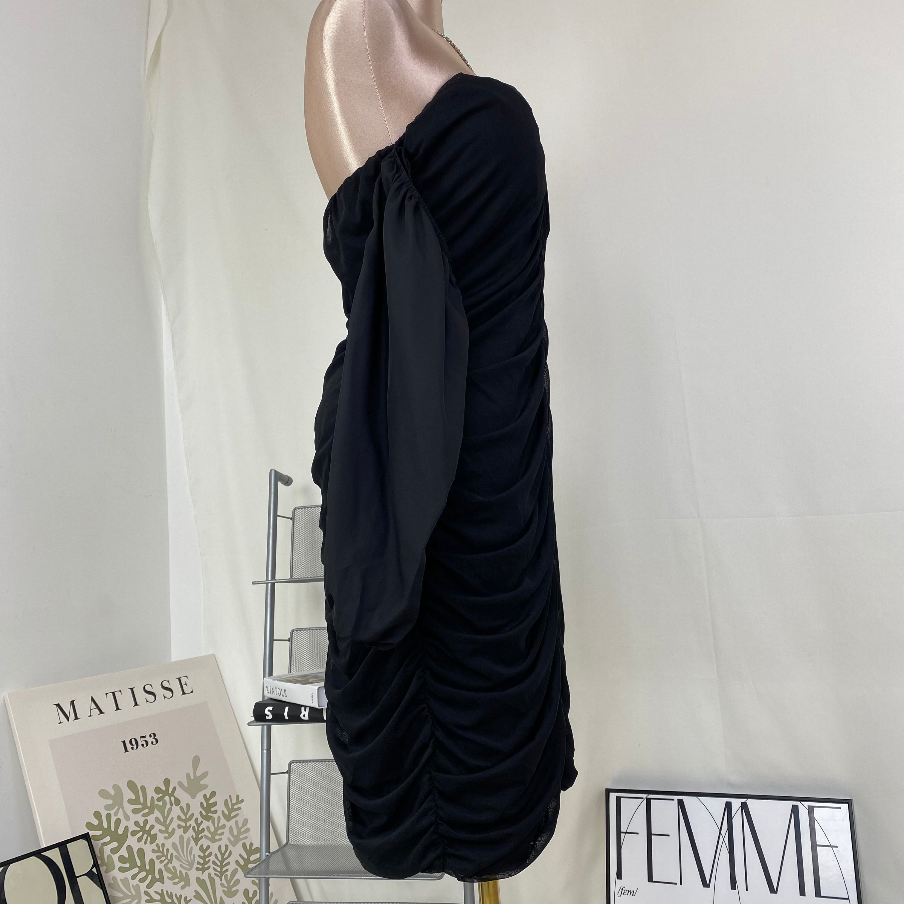 A tight-fitting short dress with a plunging neckline