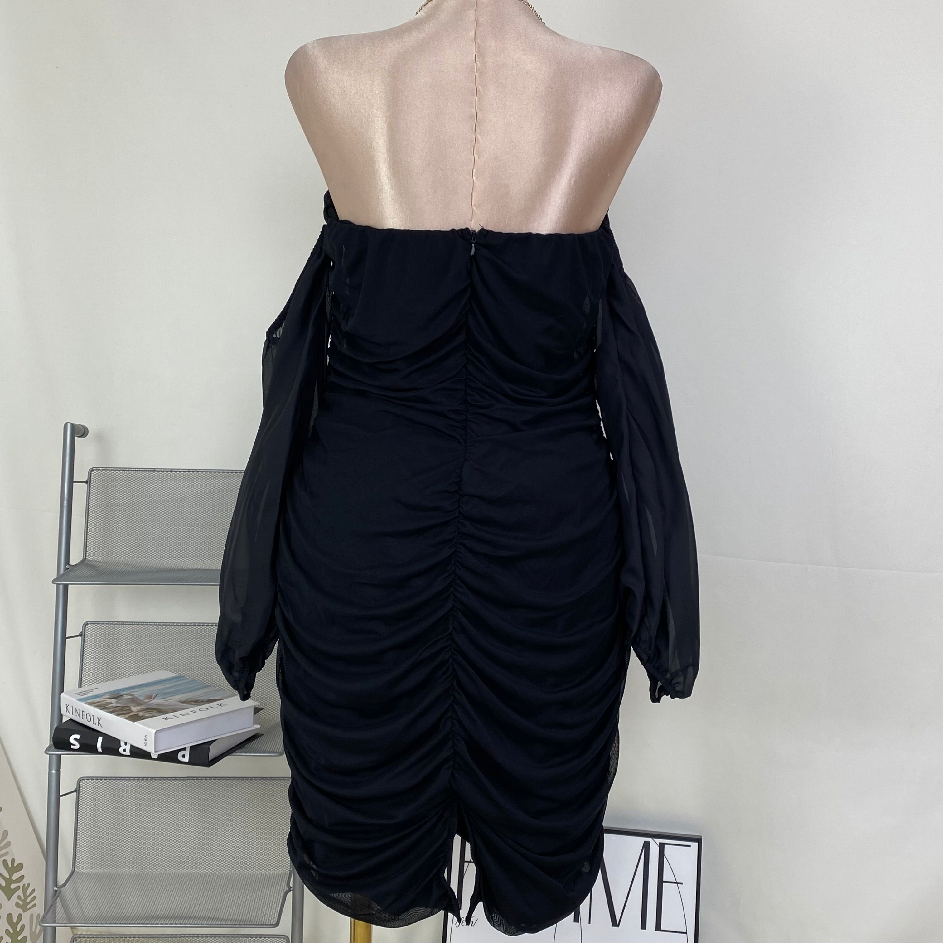 A tight-fitting short dress with a plunging neckline