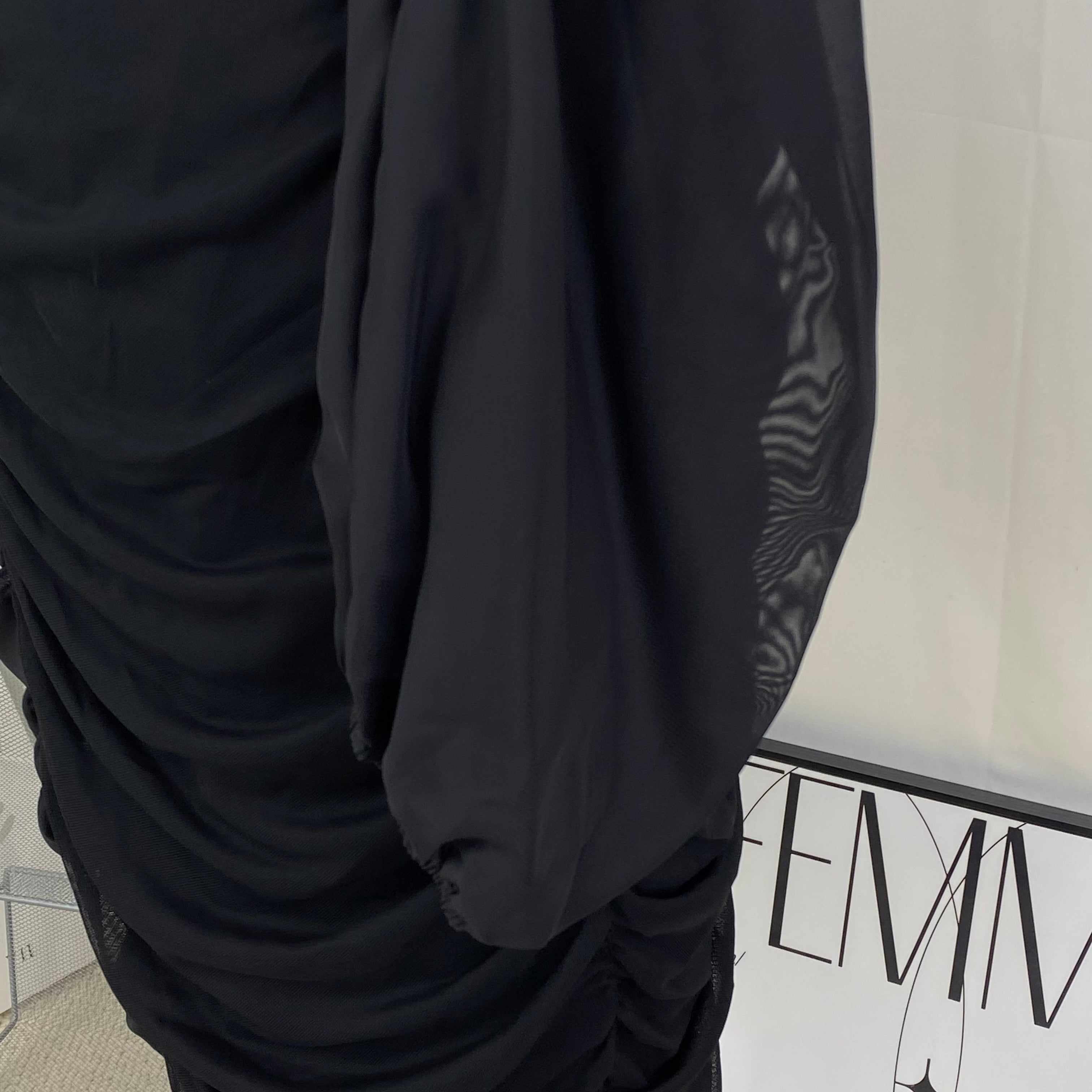 A tight-fitting short dress with a plunging neckline
