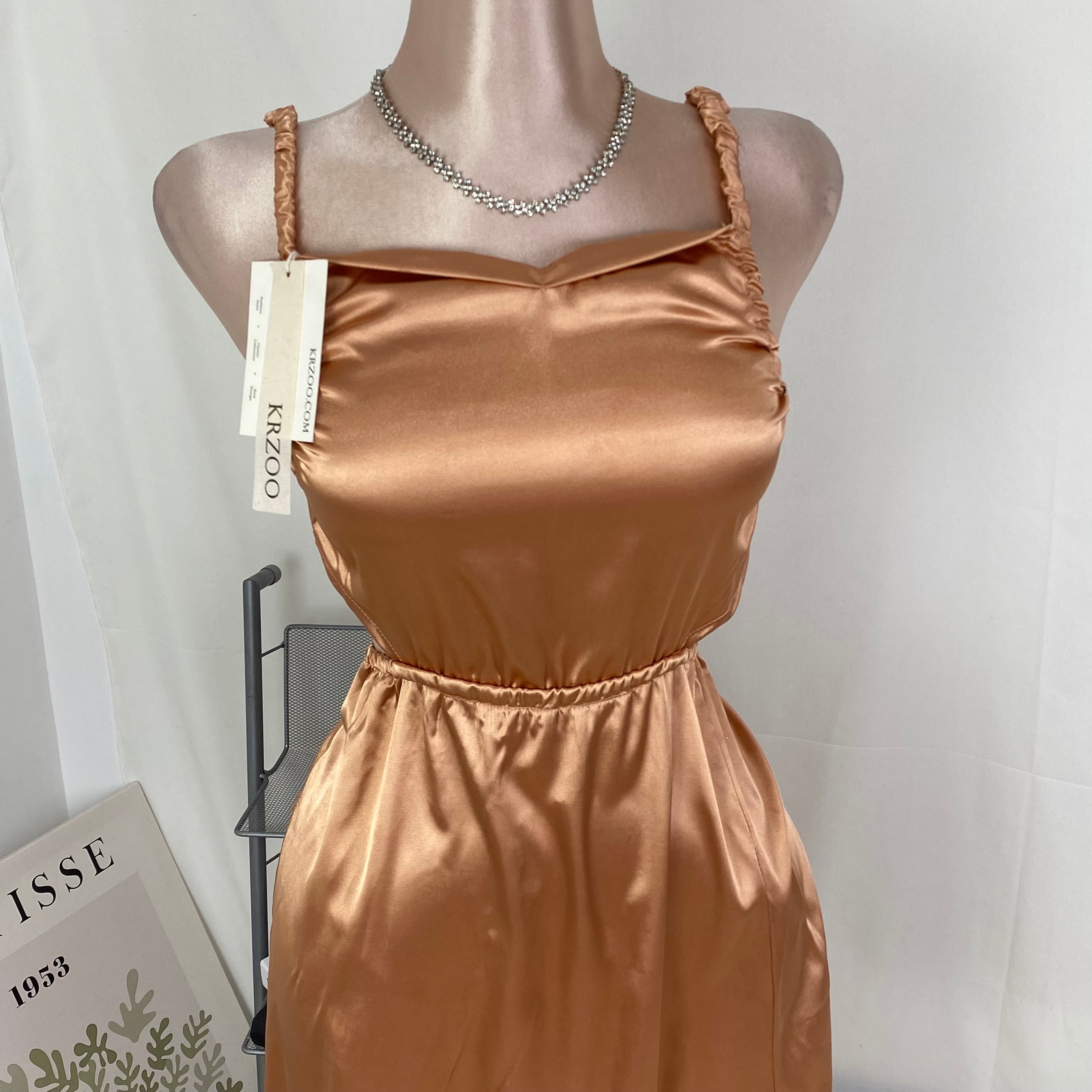 Lace-covered strapless dress with pleats