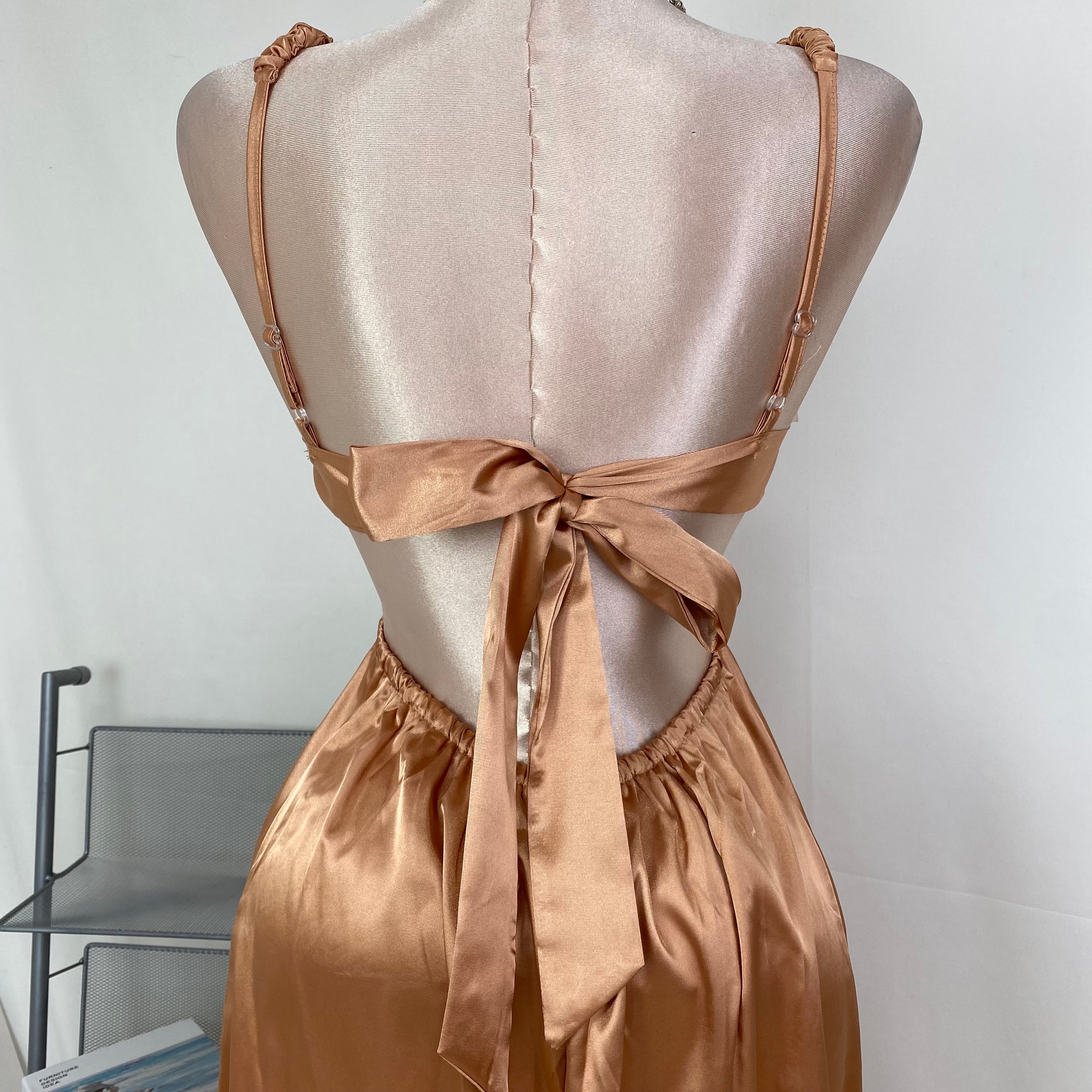 Lace-covered strapless dress with pleats
