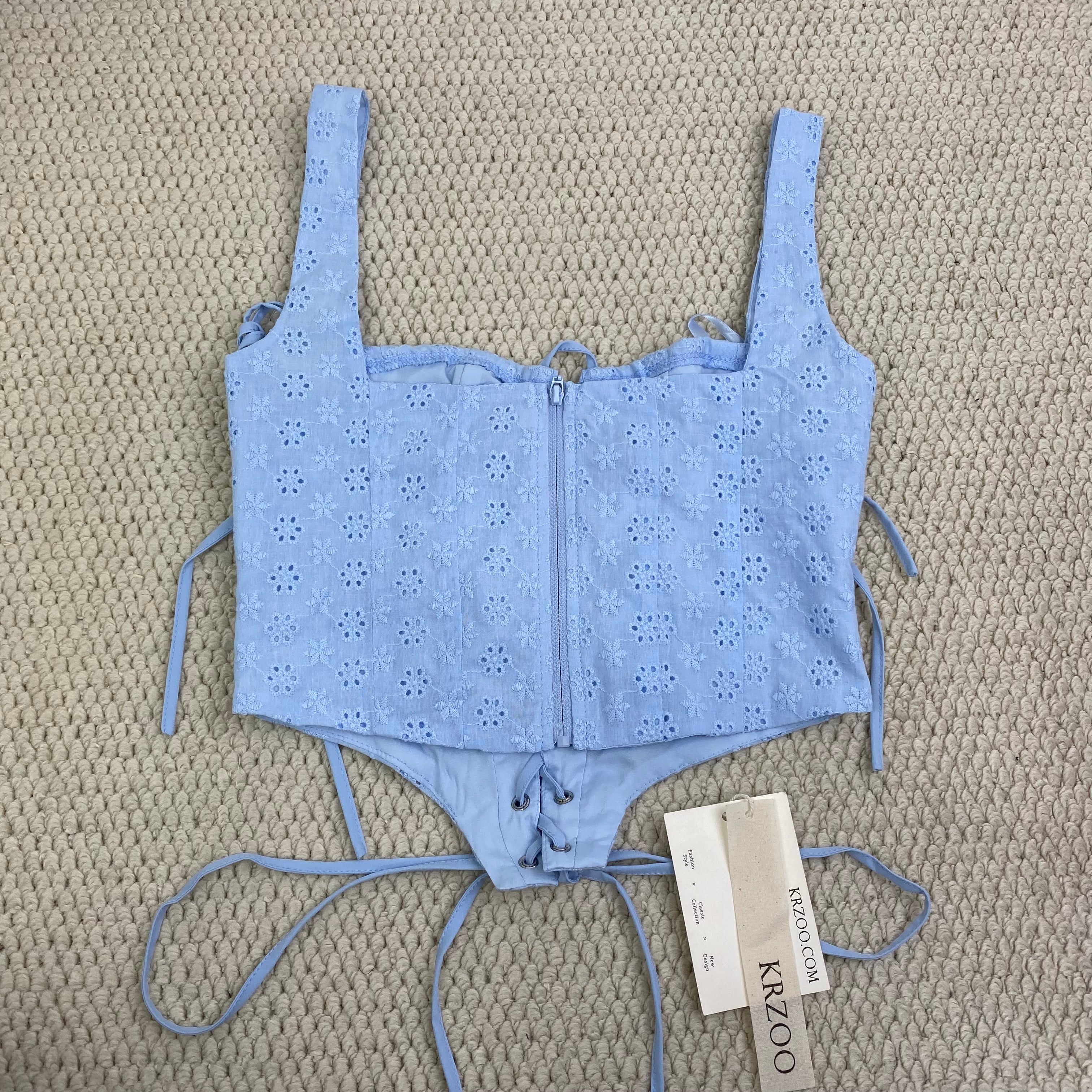 Zippered bodice with fishbone belt top garment