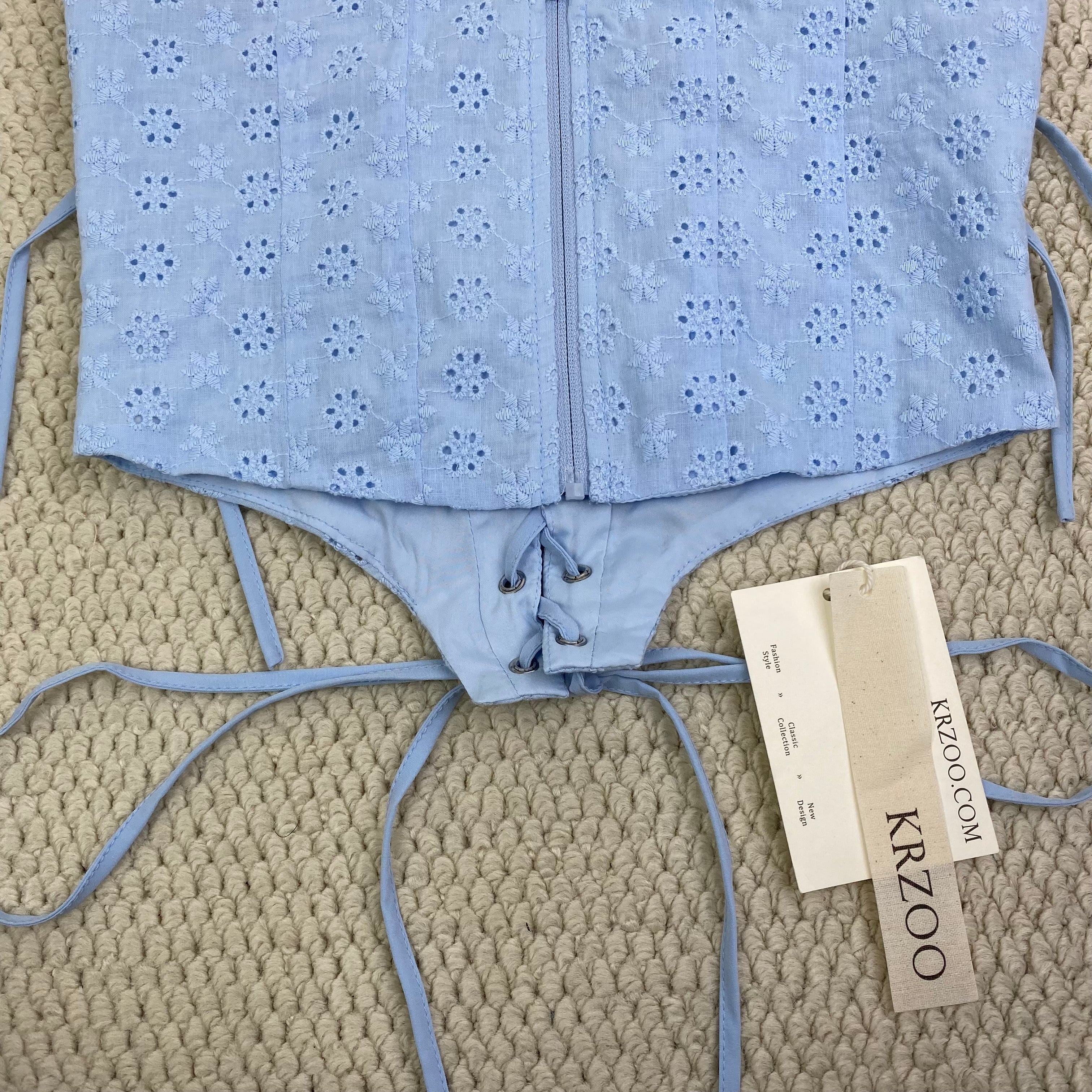 Zippered bodice with fishbone belt top garment