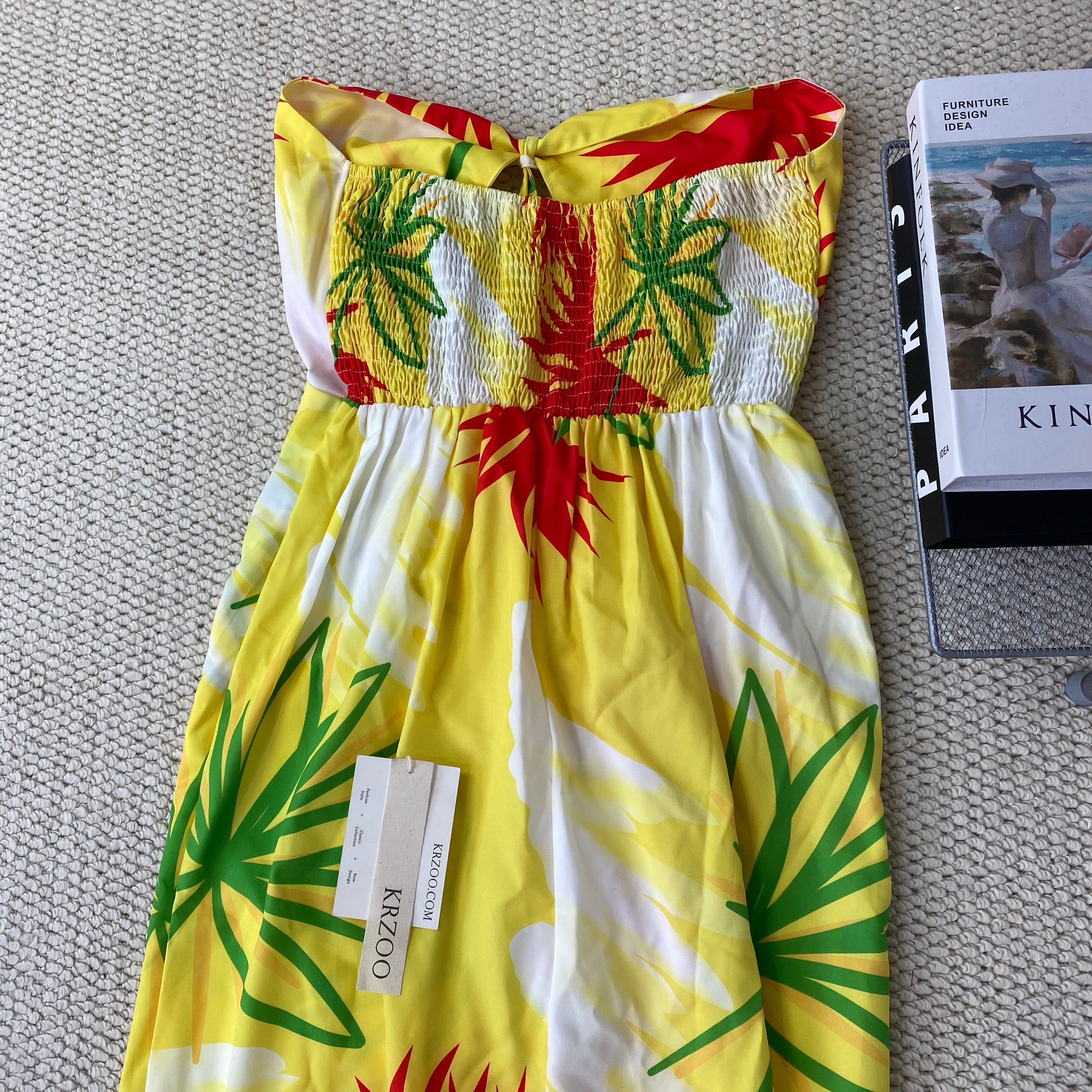 A strapless floral-printed halter dress