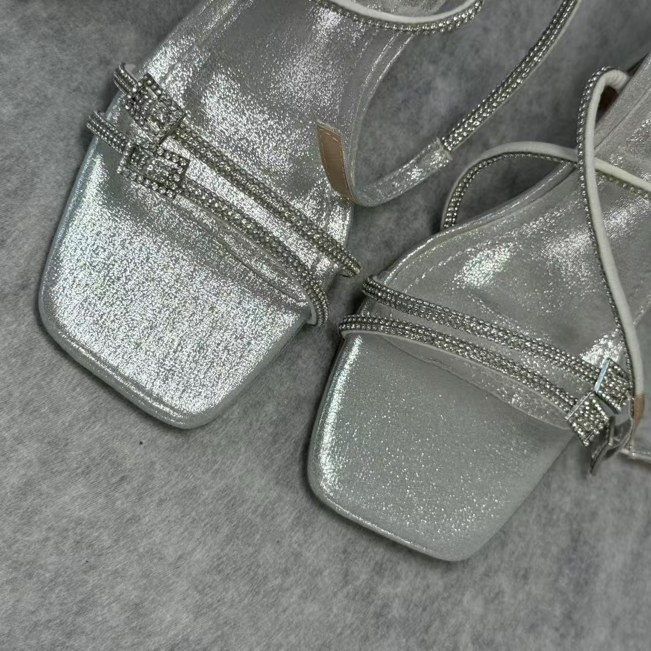 Spiked high-heeled shoes