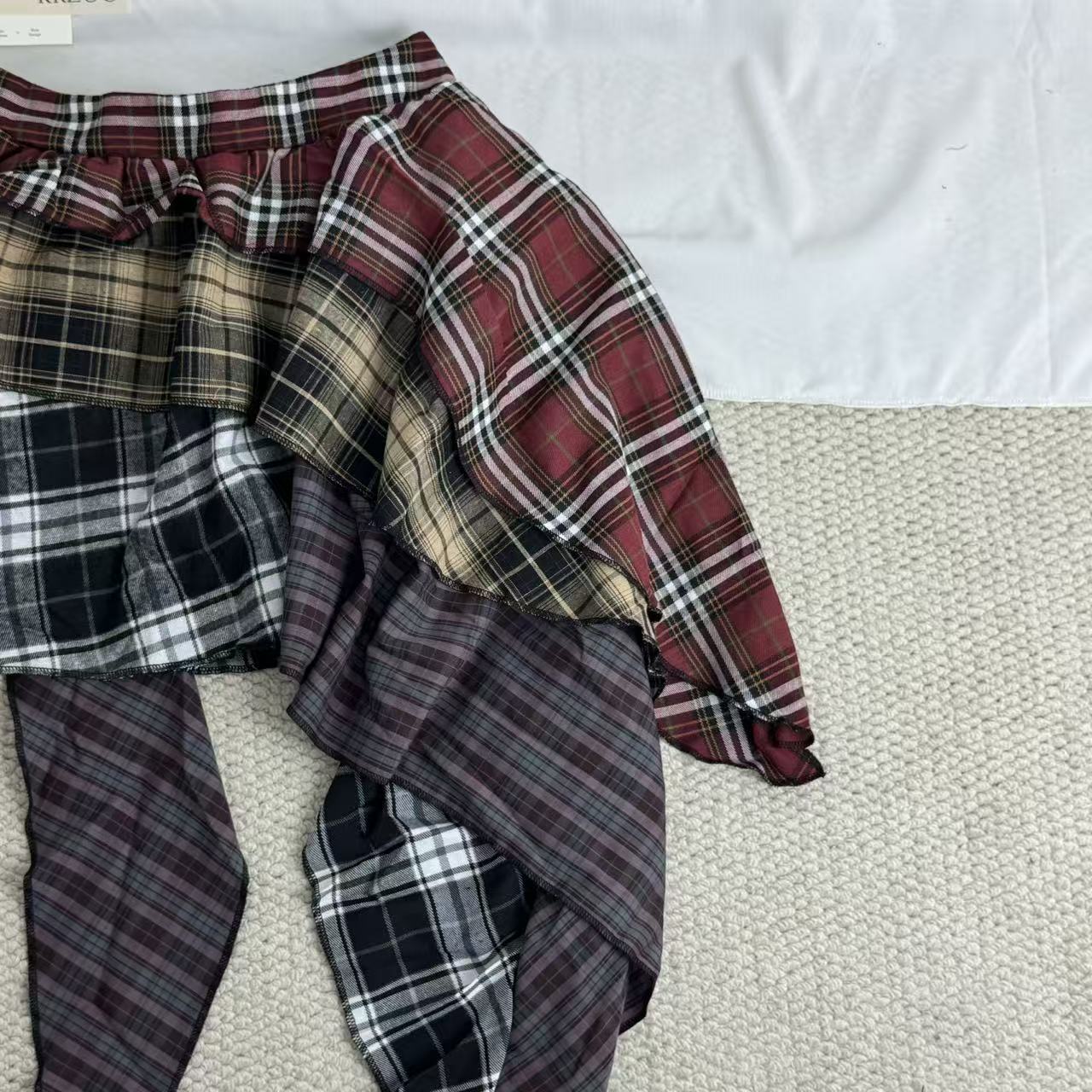 Irregular color-matched plaid half-length skirt