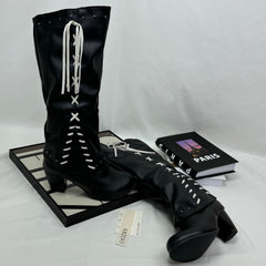Tasseled long boots made of leather