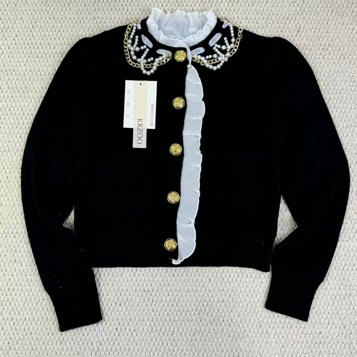 Short-sleeved blazer with ruffled edges