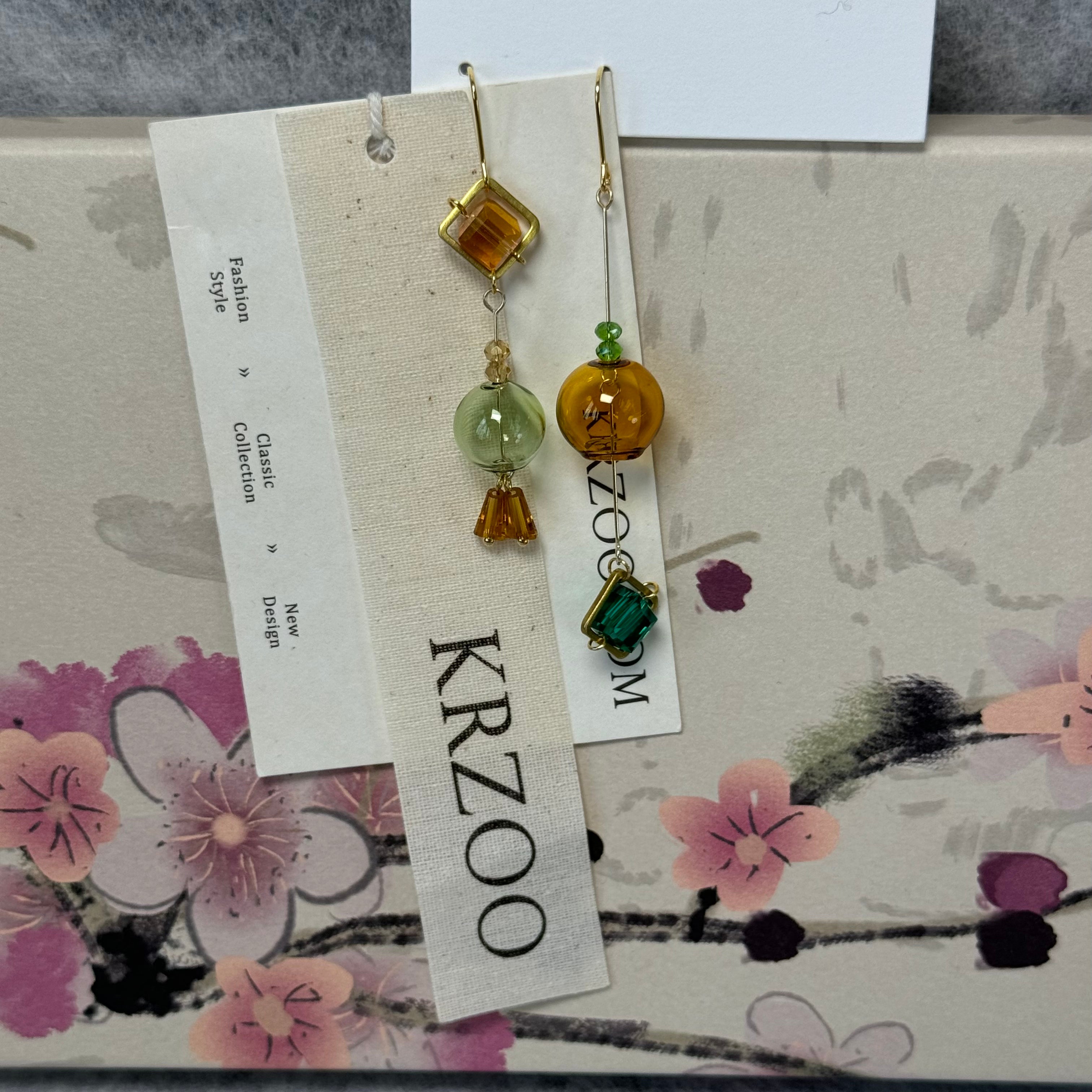 T glass ball asymmetrical long green earrings