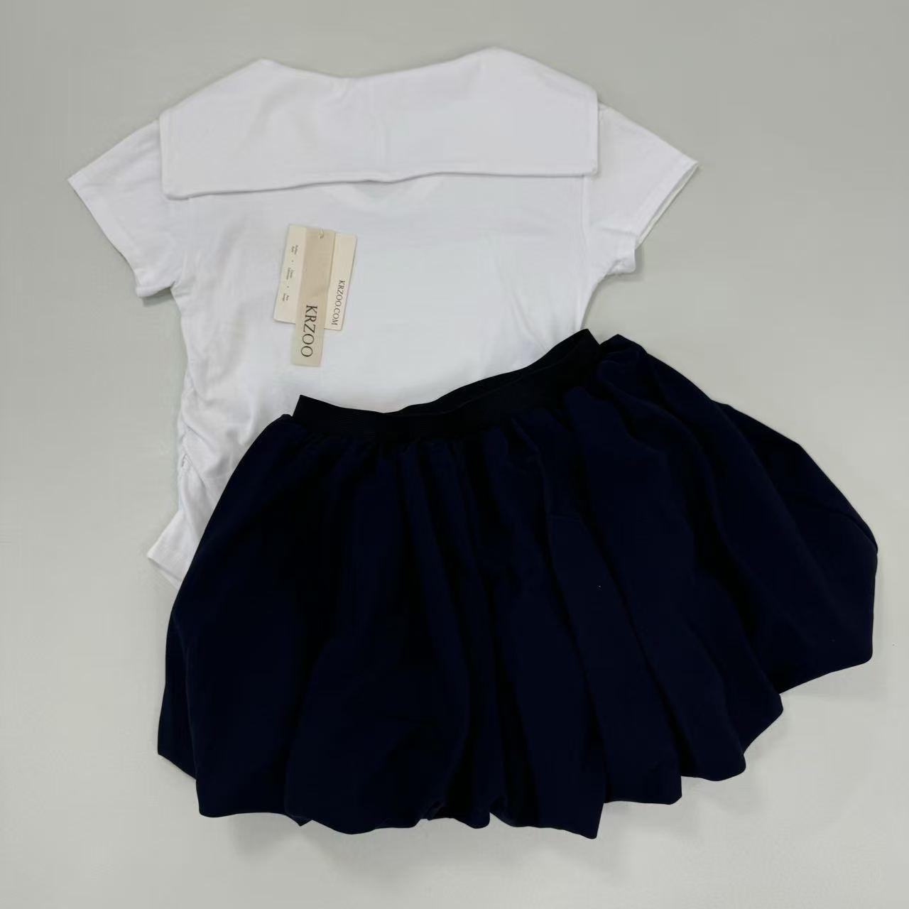 Two navy short-sleeved skirt in a set
