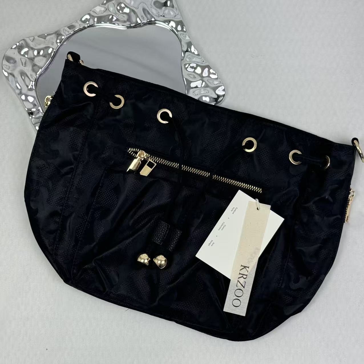 Zippered drawstring crossbody bag