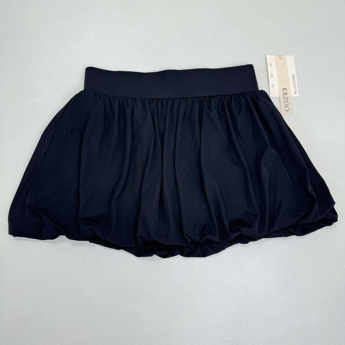 Pom-pom flowered half-length skirt