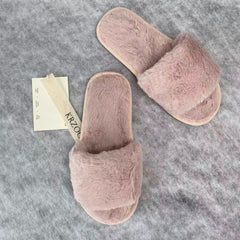 Soft plush slippers with short fur on the sole