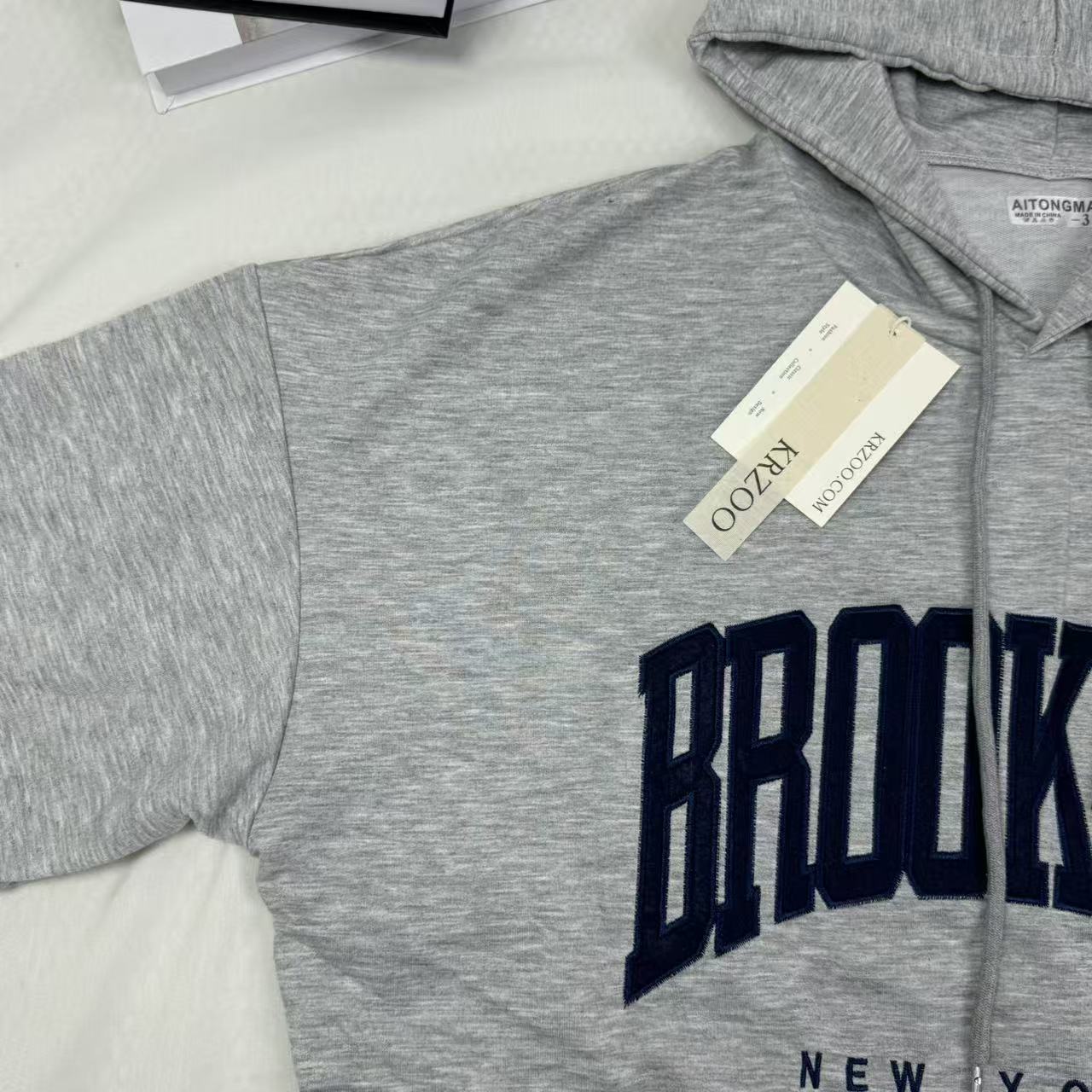 Hooded sweatshirt is loose