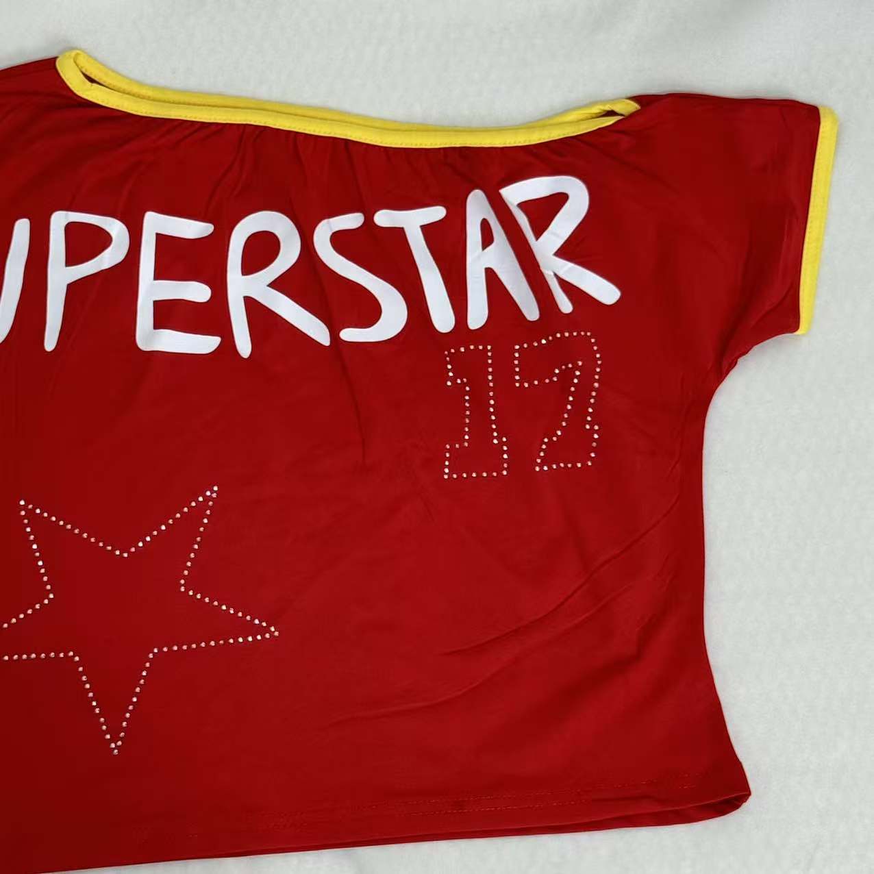 Stitched diamond lettered fitted top