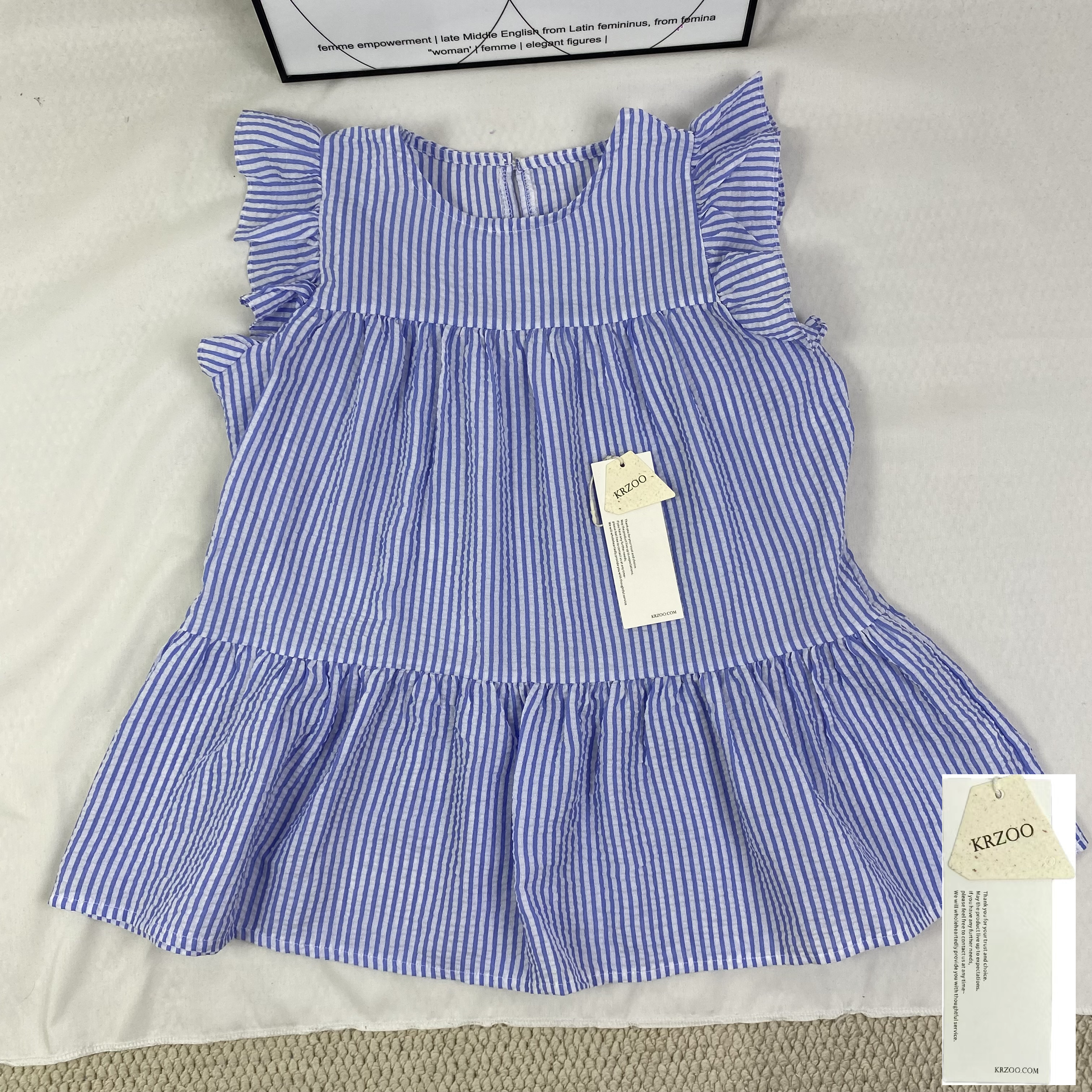 Blue and white thin striped sleeveless shirt