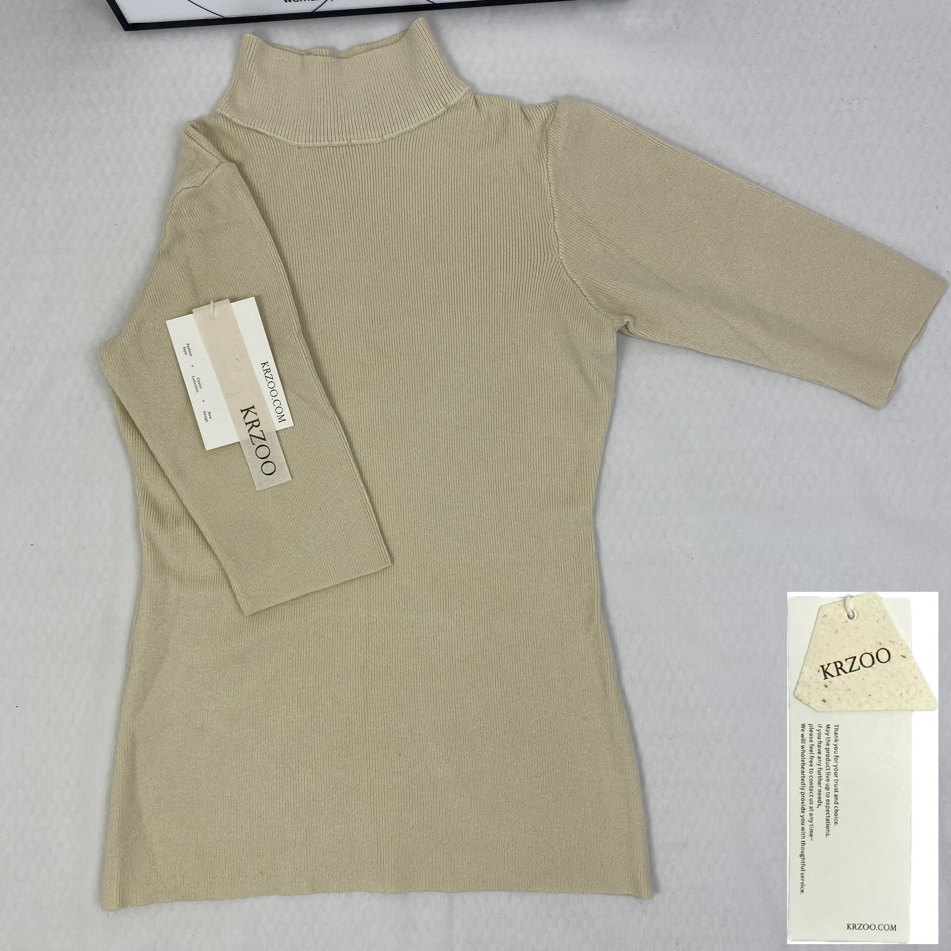 A fitted mid-neck knitted sweater