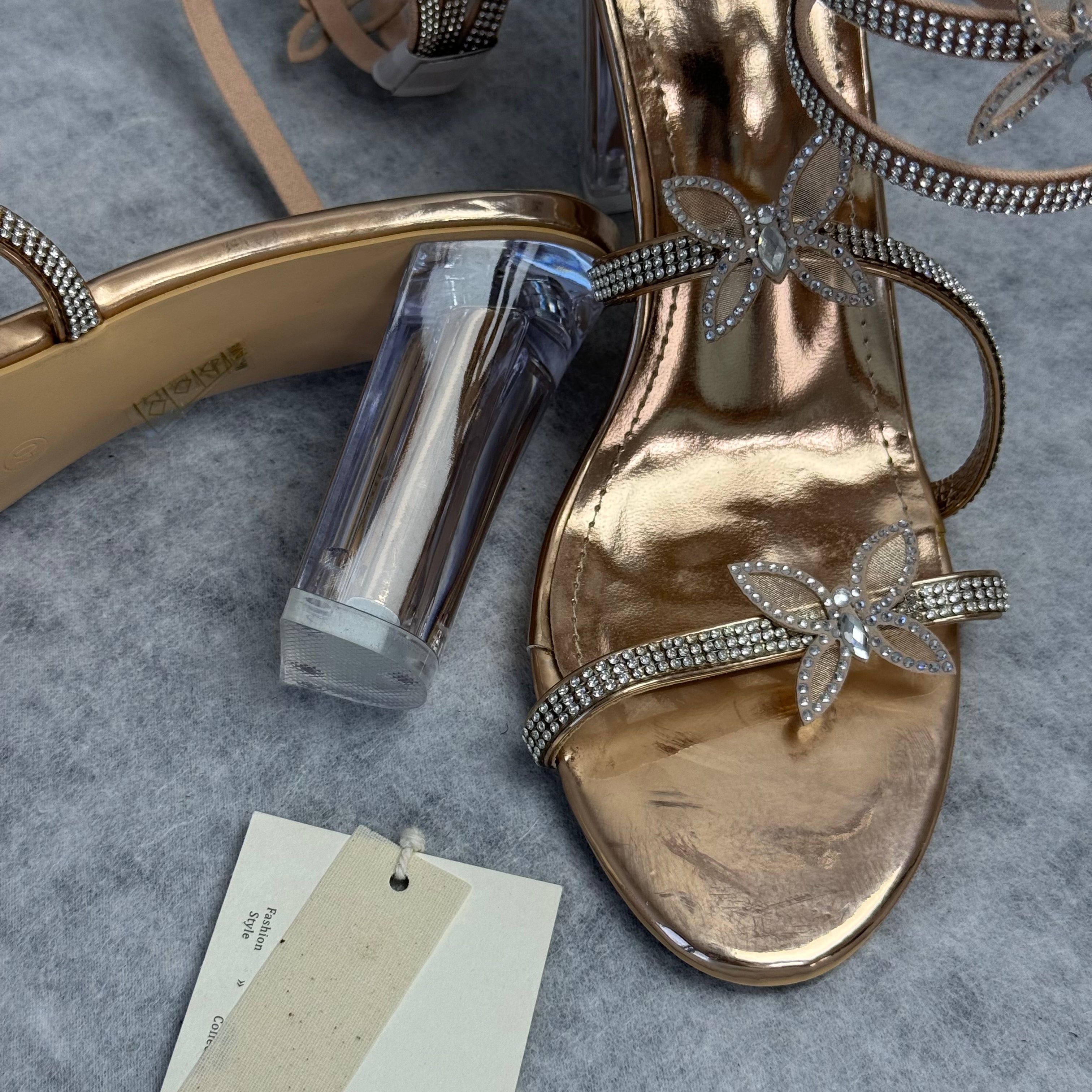 Serpentine-wrapped butterfly platform heels