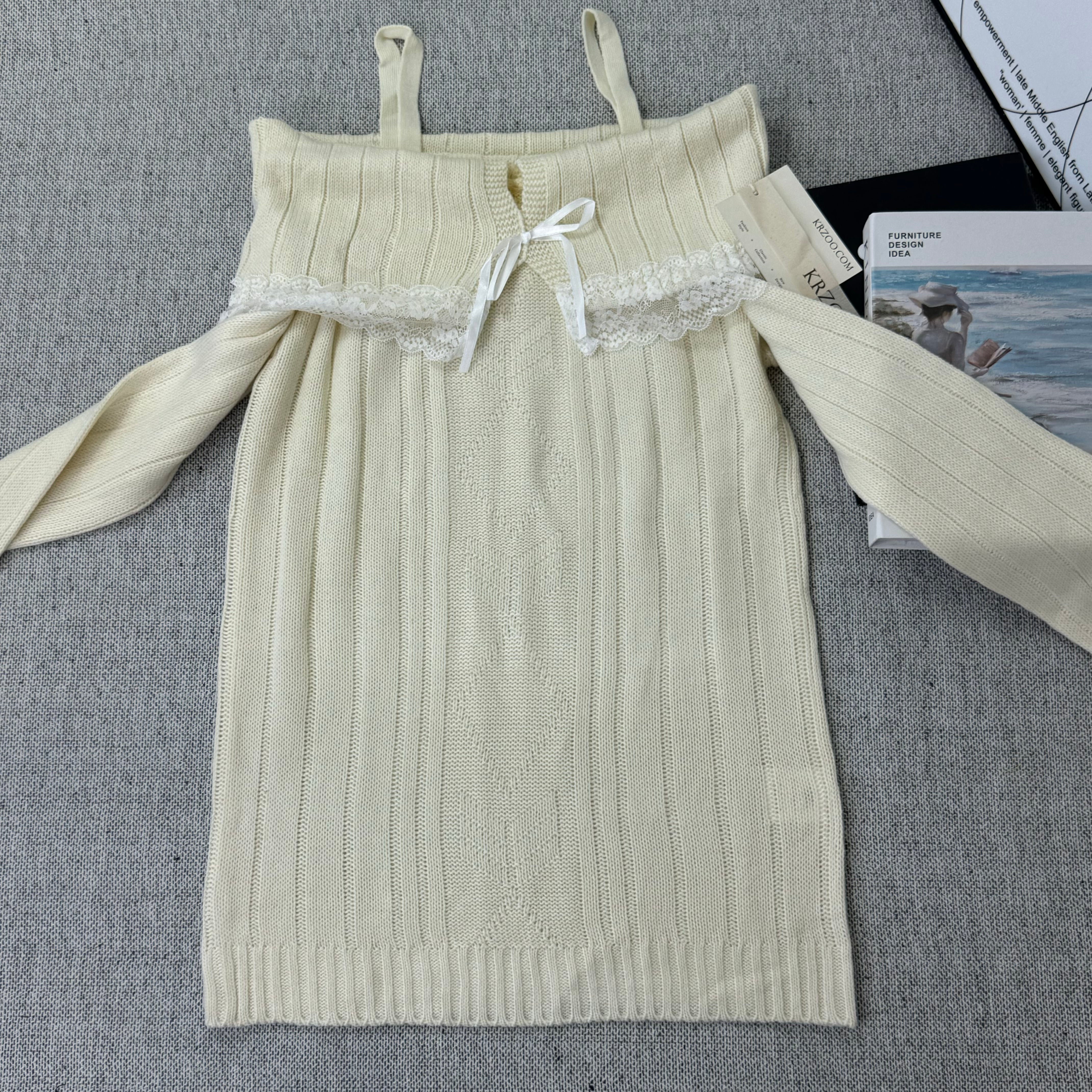 Lace trimmed one-shoulder sweater
