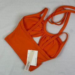 Open-necked top with a draped collar