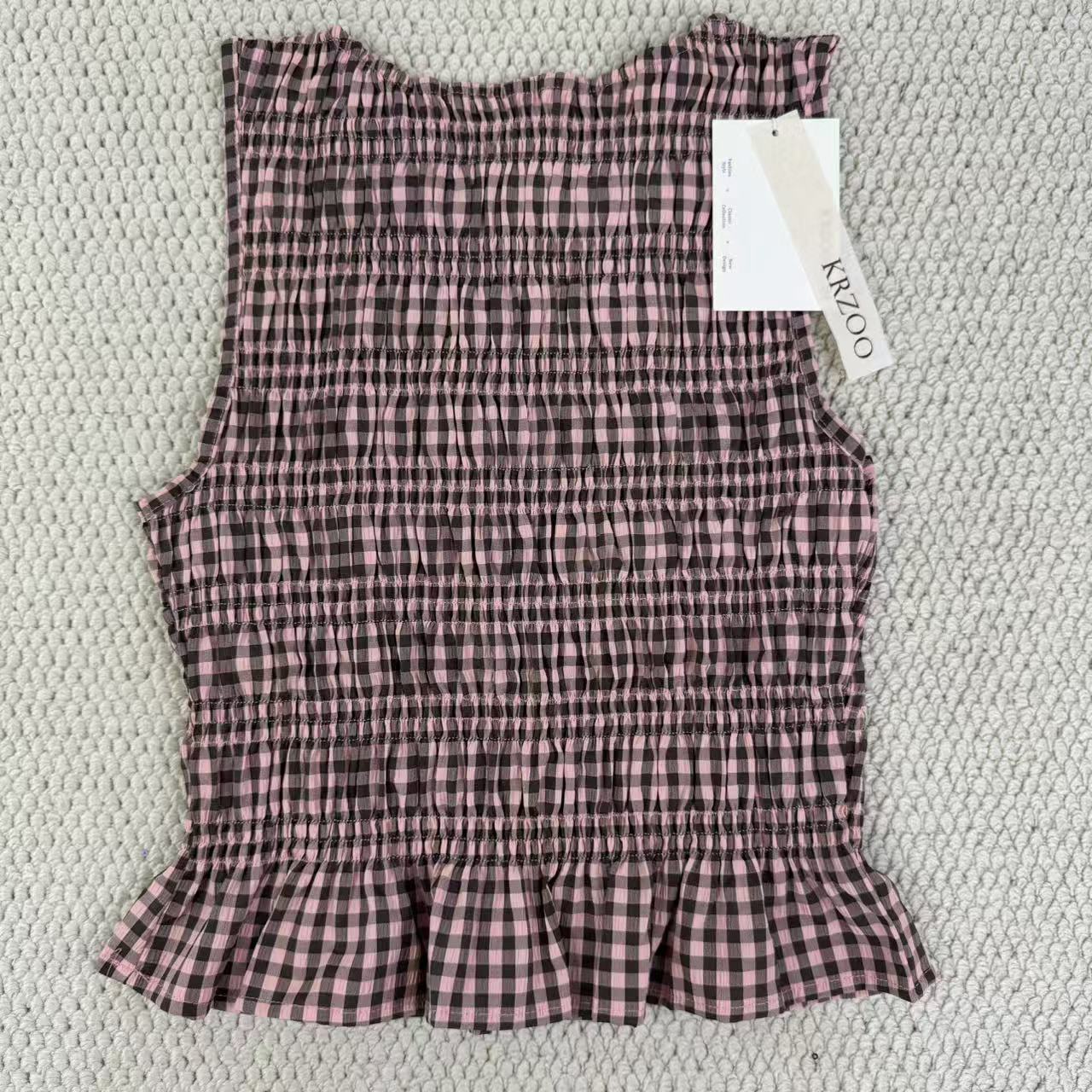 A sleeveless front-back vest