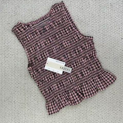 A sleeveless front-back vest